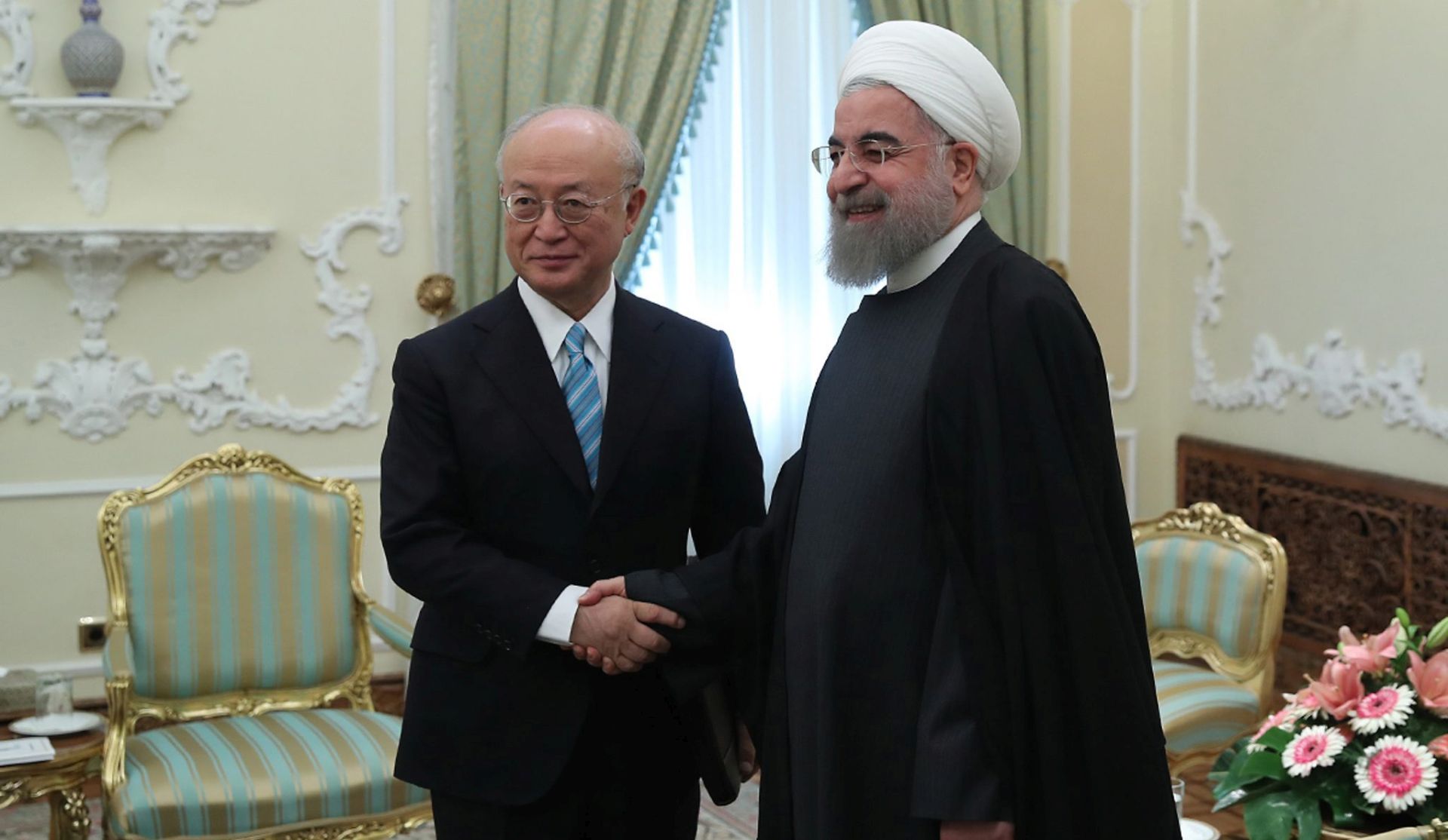 epa05680407 A handout picture made available by the Iranian President's official website on 18 December 2016 of Iranian President Hassan Rouhani (R) welcoming the Director General of the International Atomic Energy Agency (IAEA), Yukiya Amano (L) at the presidential office, in Tehran, Iran, 18 December 2016. Media reported that Amano is in Tehran to meet with Iranian officials about the latest update about Iran's nuclear deal with world powers.  EPA/PRESIDENTIAL OFFICIAL WEBSITE / HANDOUT  HANDOUT EDITORIAL USE ONLY/NO SALES