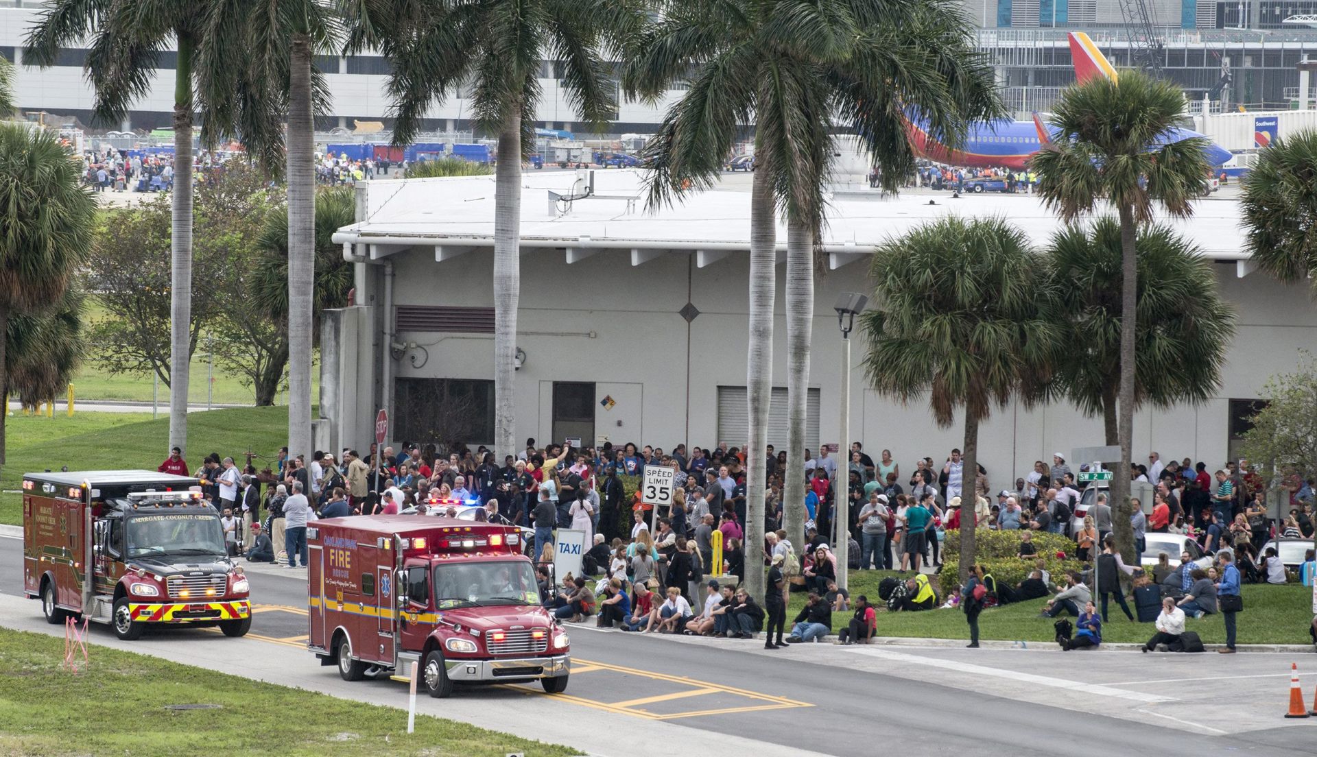 epaselect epa05702342 Firemen and ambulances wait outside the Fort Lauderdale's airport in Florida, USA, on 06 January 2017, after a gunman opened fire killing five people and injuring eight more. According to media reports a suspect is in custody.  EPA/GIORGIO VIERA