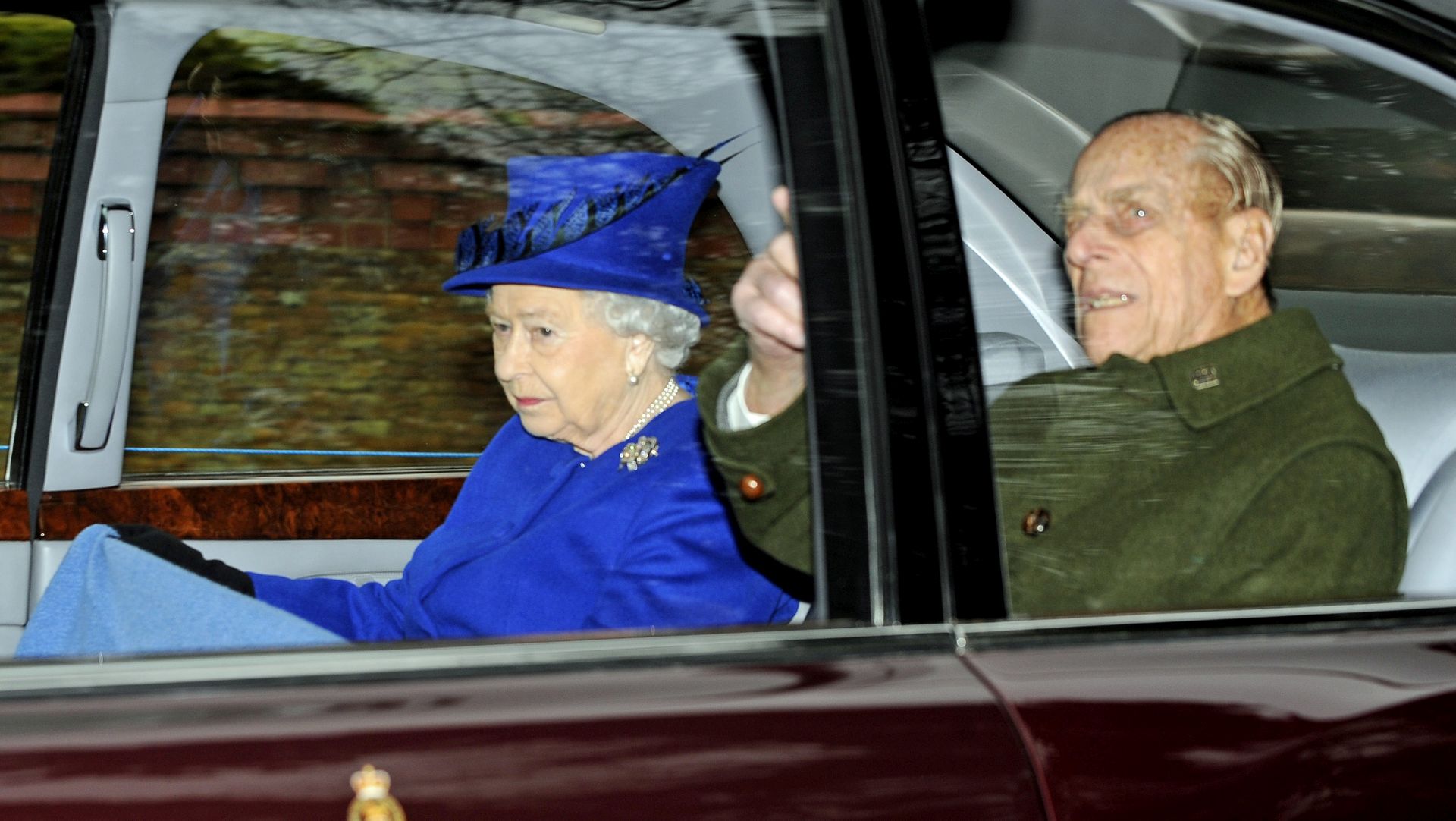 epa05704774 Queen Elizabeth (L) leaves with the Duke of Edinburgh the St. Mary Magdalene Church at Sandringham, Norfolk 08 January 2017. The Queen has recovered from a recent illness which prevented her from attending church over Christmas.  EPA/GERRY PENNY