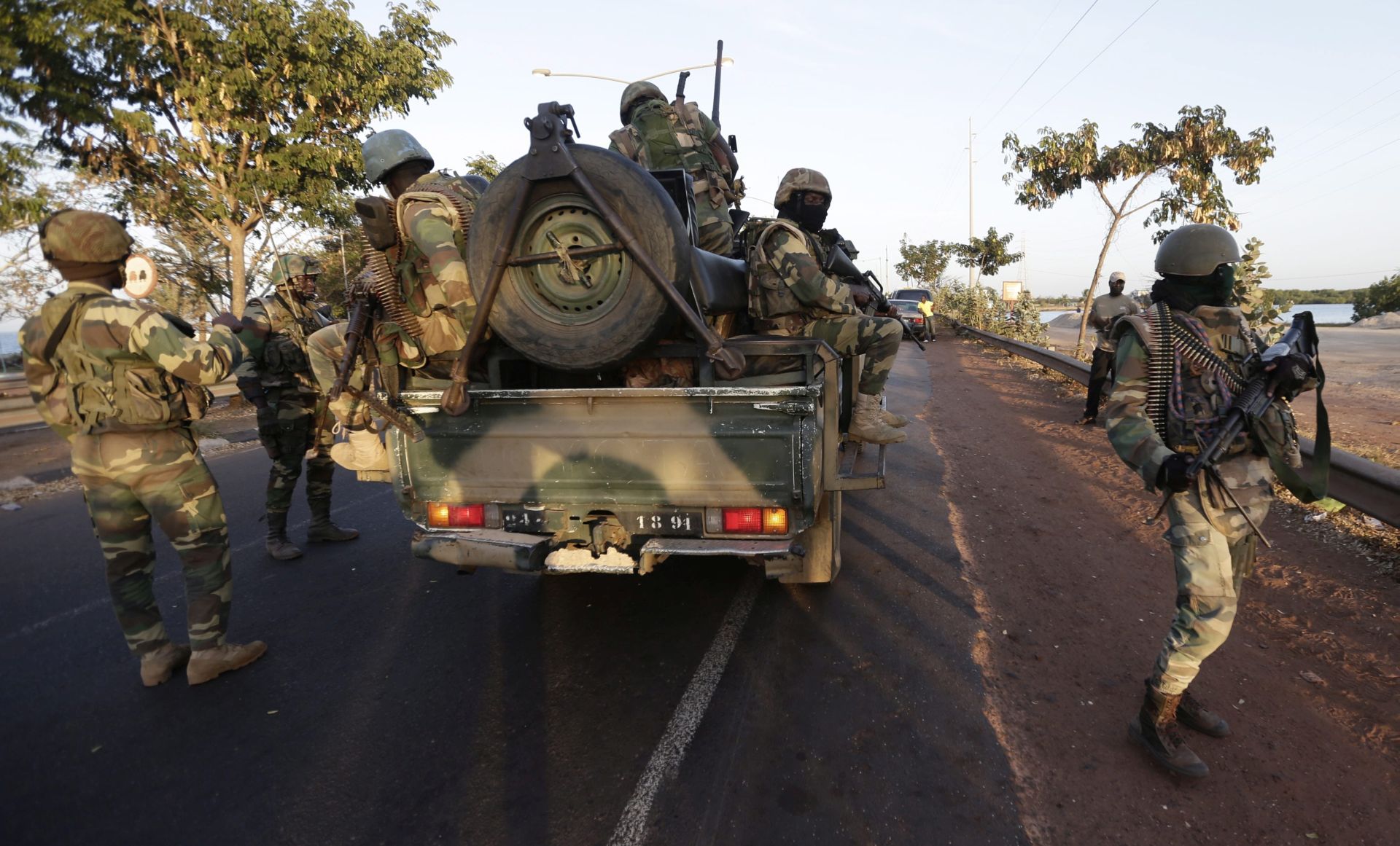 epa05742493 Senegalese soldiers patrol in Banjul, Gambia, 22 January 2017. Life is returning to normal on the streets of Banjul with the departure of ex president Yahya Jammeh who has been flown out of the country to exile in Equatorial Guinea, according to regional group Ecowas. Gambians await the arrival of President Adama Barrow who was sworn in as president of Gambia at the Gambia embassy in Dakar, Senegal, on 19 January 2017.  EPA/LEGNAN KOULA