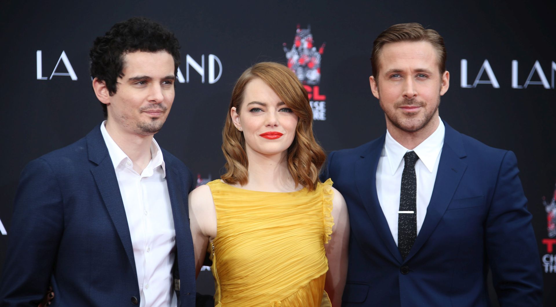epa05746775 (FILE) A file picture dated 07 December 2016 shows US actress Emma Stone (C) and Canadian actor Ryan Gosling (R) as they pose with US director Damien Chazelle (L) during a hand and footprint ceremony honoring Stone and Gosling at the TCL Chinese Theatre in Hollywood, California, USA. The movie 'La La Land' by Damien Chazelle leads the Oscar nominations with 14 nods for, among others, Best Film, Best Director for Damien Chazelle, Best Actor for Ryan Gosling, Best Actress for Emma Stone.  EPA/MIKE NELSON