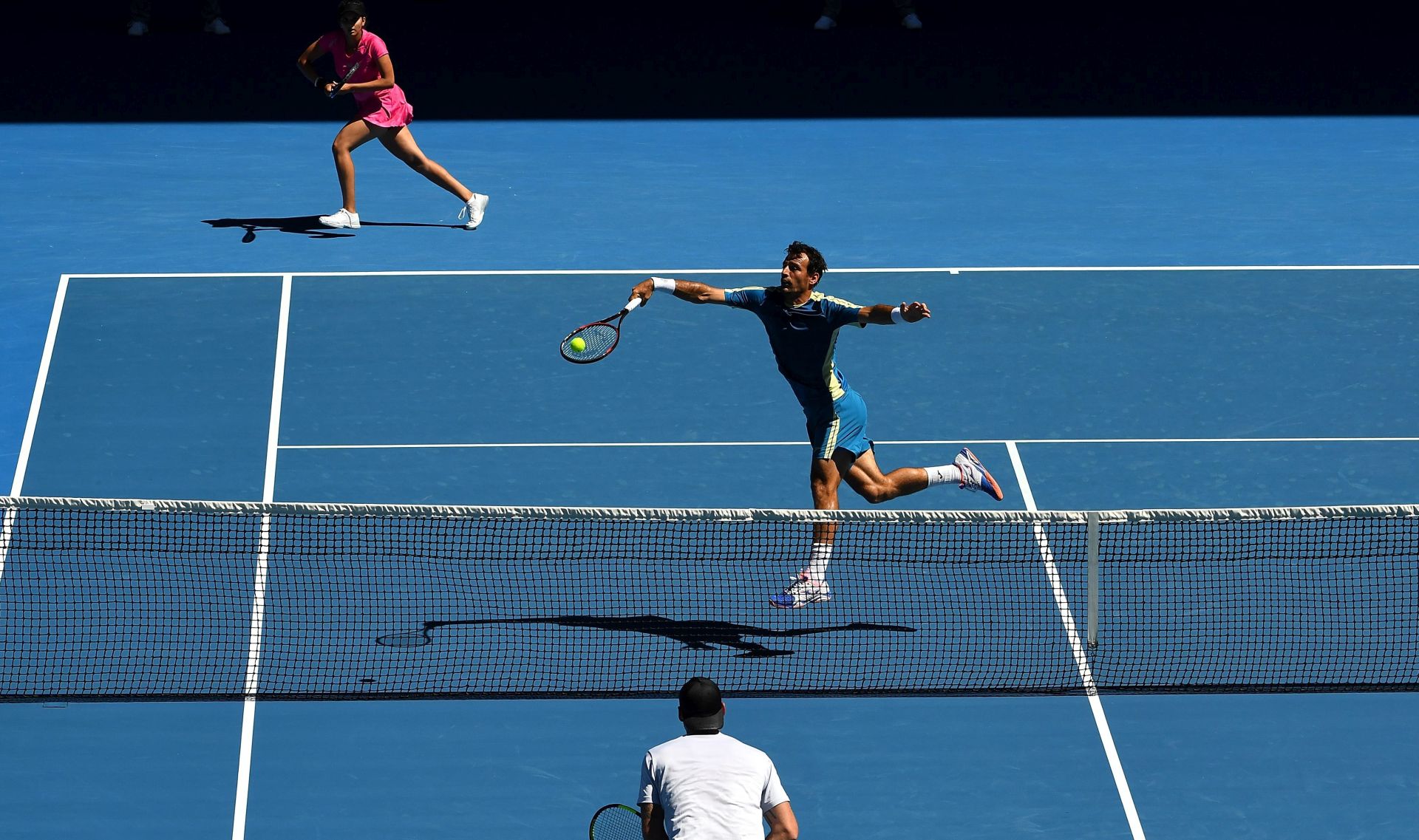 epa05753394 Sania Mirza (L) of India and Ivan Dodig (R) of Croatia in action against Samantha Stosur and Sam Groth (C) of Australia during the Mixed Doubles semifinals match at the Australian Open Grand Slam tennis tournament in Melbourne, Australia, 27 January 2017.  EPA/TRACEY NEARMY AUSTRALIA AND NEW ZEALAND OUT