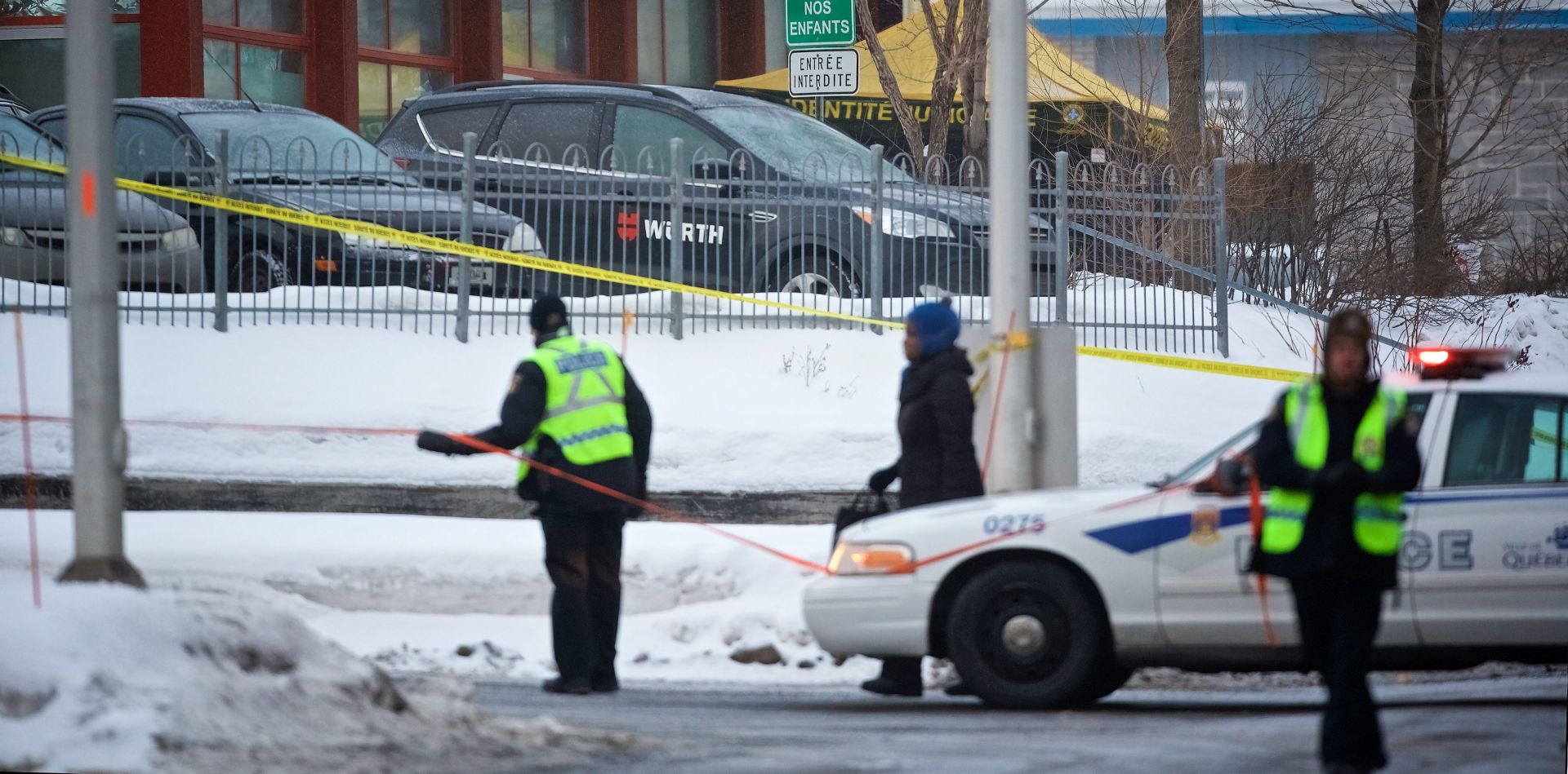 epa05761393 Municipal police patrols the scene where two gunmen opened fire in a Quebec City mosque during evening prayers on 29 January, killing six people and injuring eight others, at the Quebec Islamic Cultural Centre in Quebec City, Quebec, Canada, 30 January 2017. According to the police, six people were killed and another eight were wounded in a shooting at a Mosque during evening prayers on 29 January. Two suspects have been taken into custody. Canadian Prime Minister Justin Trudeau described the incident as a 'terrorist attack on Muslims,' media reported quoting his statement.  EPA/ANDRE PICHETTE