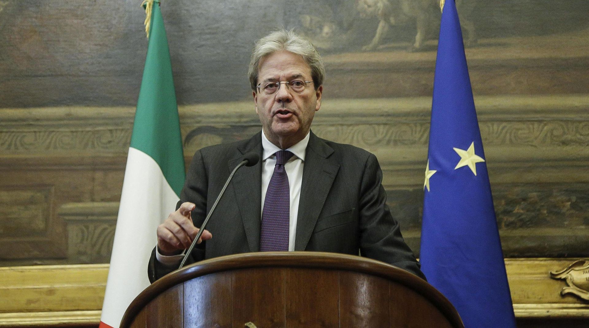 epa05672544 Italian Prime Minister in charge Paolo Gentiloni speaks after the end of his talks with parties, Rome, Italy, 12 December 2016. Italian Premier-designate will present his new cabinet later in the day. President Sergio Mattarella on 11 December gave the former foreign minister a mandate to form a new government in the wake of Matteo Renzi's resignation as premier last week, following a crushing defeat in a 04 December constitutional referendum.  EPA/GIUSEPPE LAMI
