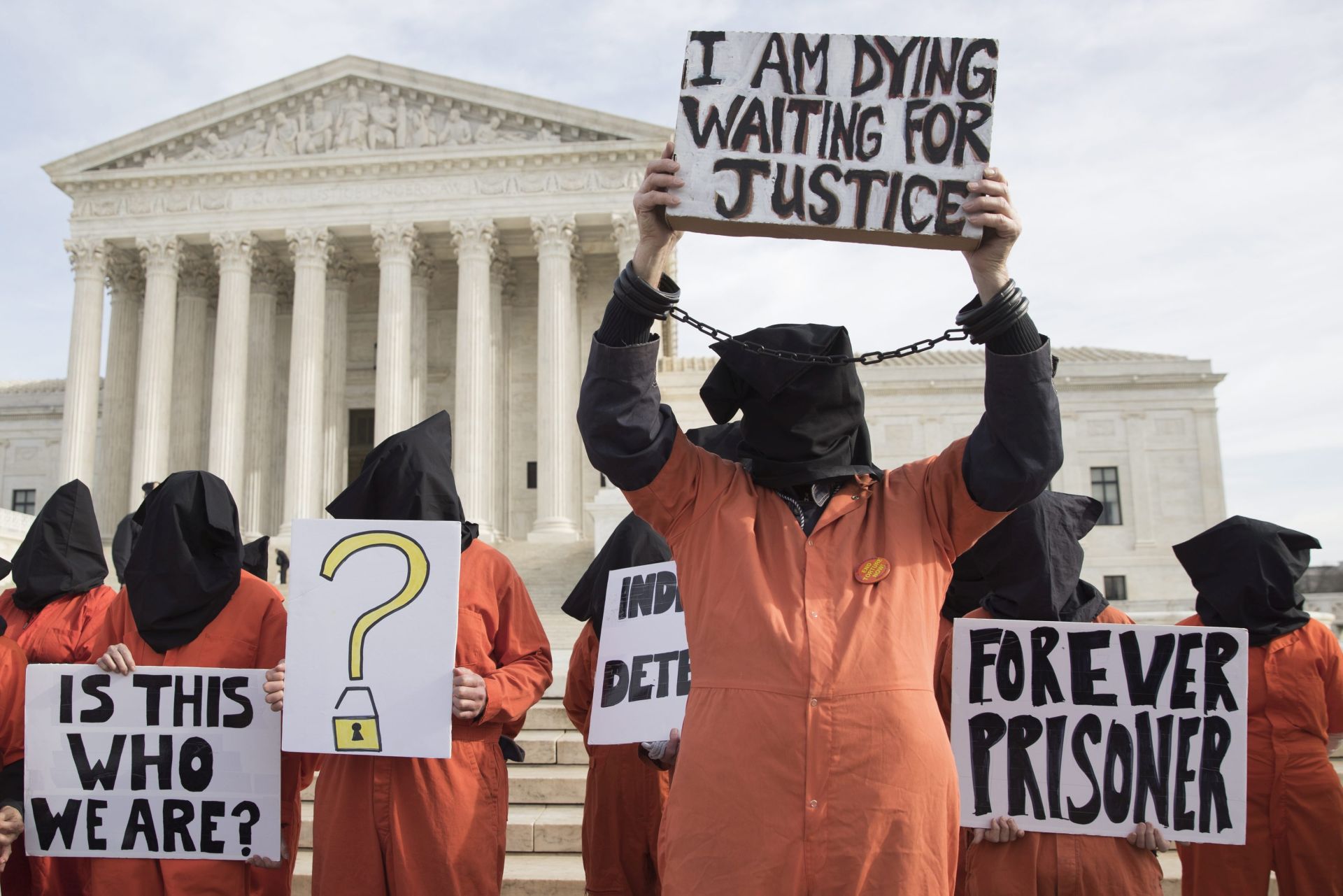 epa05711436 Protesters urge for the closure of Guantanamo Bay detention camp, outside the US Supreme Court in Washington, DC, USA, 11 January 2017. The closure of Guantanamo Bay detention camp was a promise made by Barack Obama during his first campaign for the presidency. The inmate population in the facility has been been greatly reduced but the effort to close it was blocked by Congress during Obama's first year as President.  EPA/MICHAEL REYNOLDS