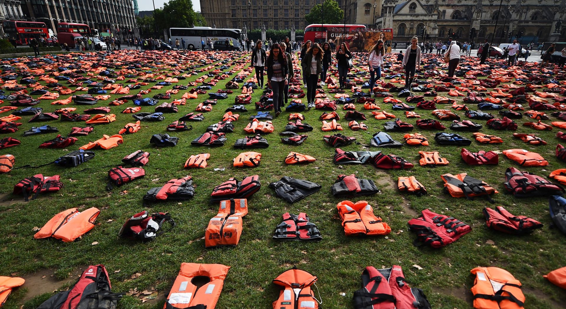 epa05547646 Life jackets worn by fleeing refugees lie in Parliament Square in London, Britain, 19 September. Thousands of life-jackets were laid out in Parliament Square to highlight the need to protect refugees and migrants. The jackets serve as a visual reminder of the suffering and risks hundreds of thousands of refugees have endured. World leaders are meeting at the United Nations Migration summit in New York these days.  EPA/ANDY RAIN