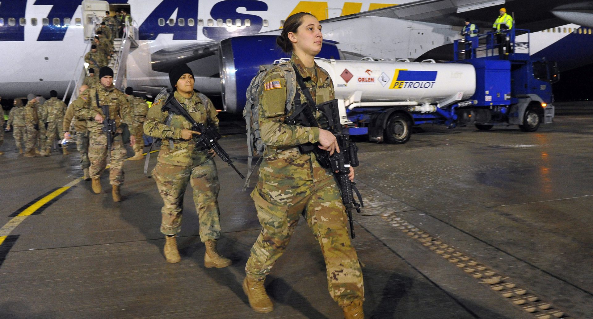 epa05713800 US soldiers arrive at the airport in Goleniow, Poland, 12 January 2017. Some 173 US soldiers arrived to Goleniow as part of an effort to reinforce NATO's eastern flank. The American armoured brigade - the 3rd Armored Brigade Combat Team, part of the 4th Infantry Division, from Fort Carson, Colorado, is to be deployed to Poland as well as the Baltic states and Romania as part of Operation Atlantic Resolve.  EPA/MARCIN BIELECKI POLAND OUT