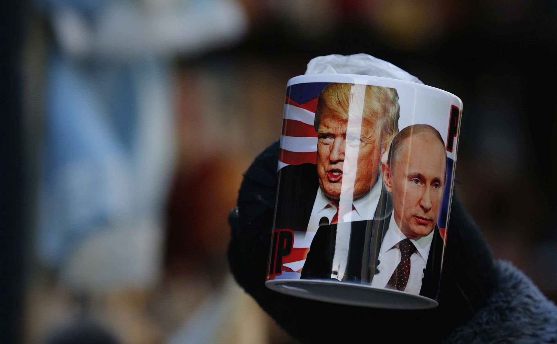 epa05734373 A mug depicting Donald Trump and Russian President Vladimir Putin on sale several hours before Donald J. Trump is sworn in as the 45th President of the United States, at a souvenir street shop in St. Petersburg, Russia, 20 January 2017. Trump won the 08 November 2016 election to become the next US President.  EPA/ANATOLY MALTSEV