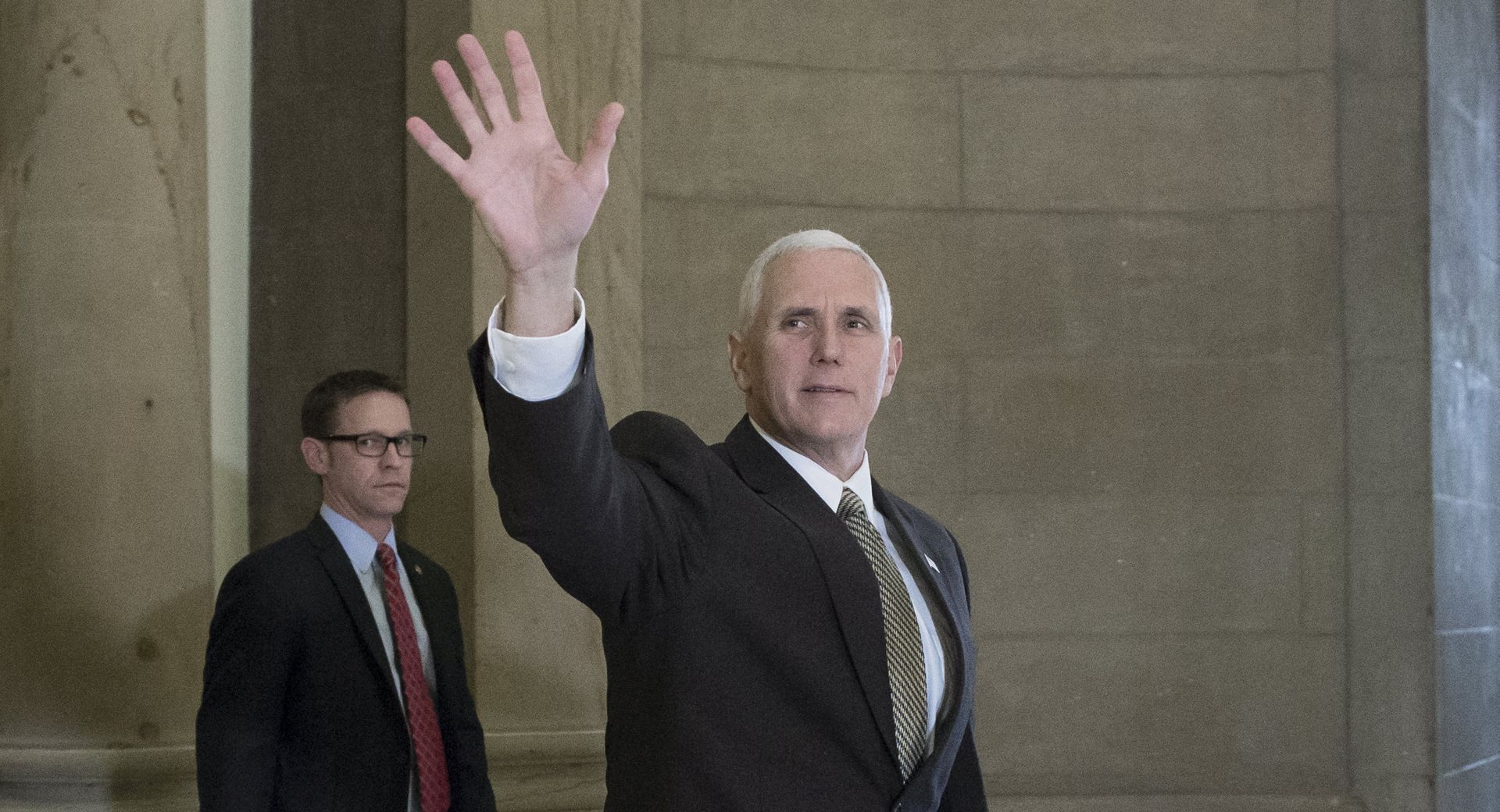 epa05778713 US Vice President Mike Pence (R) waves as he leaves the office of the Speaker of the House Republican Paul Ryan (not pictured), on Capitol Hill in Washington, DC, USA, 08 February 2017.  Pence attended a series of meetings on Capitol Hill.  EPA/MICHAEL REYNOLDS