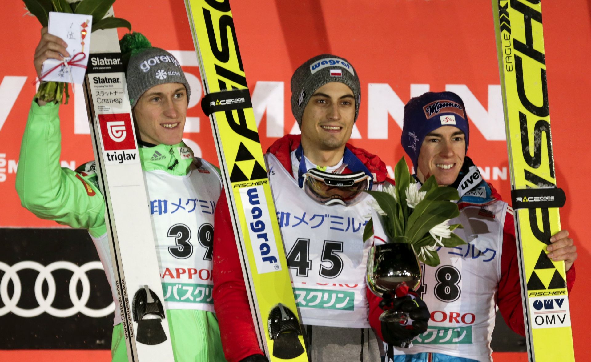epa05784656 (L-R) joint winners Peter Prevc of Slovenia and Maciej Kot of Poland, and third placed  Stefan Kraft of Austria celebrate on the podium for the large hill individual competition at the Ski Jumping World Cup in Sapporo, Japan, 11 February 2017.  EPA/KIMIMASA MAYAMA