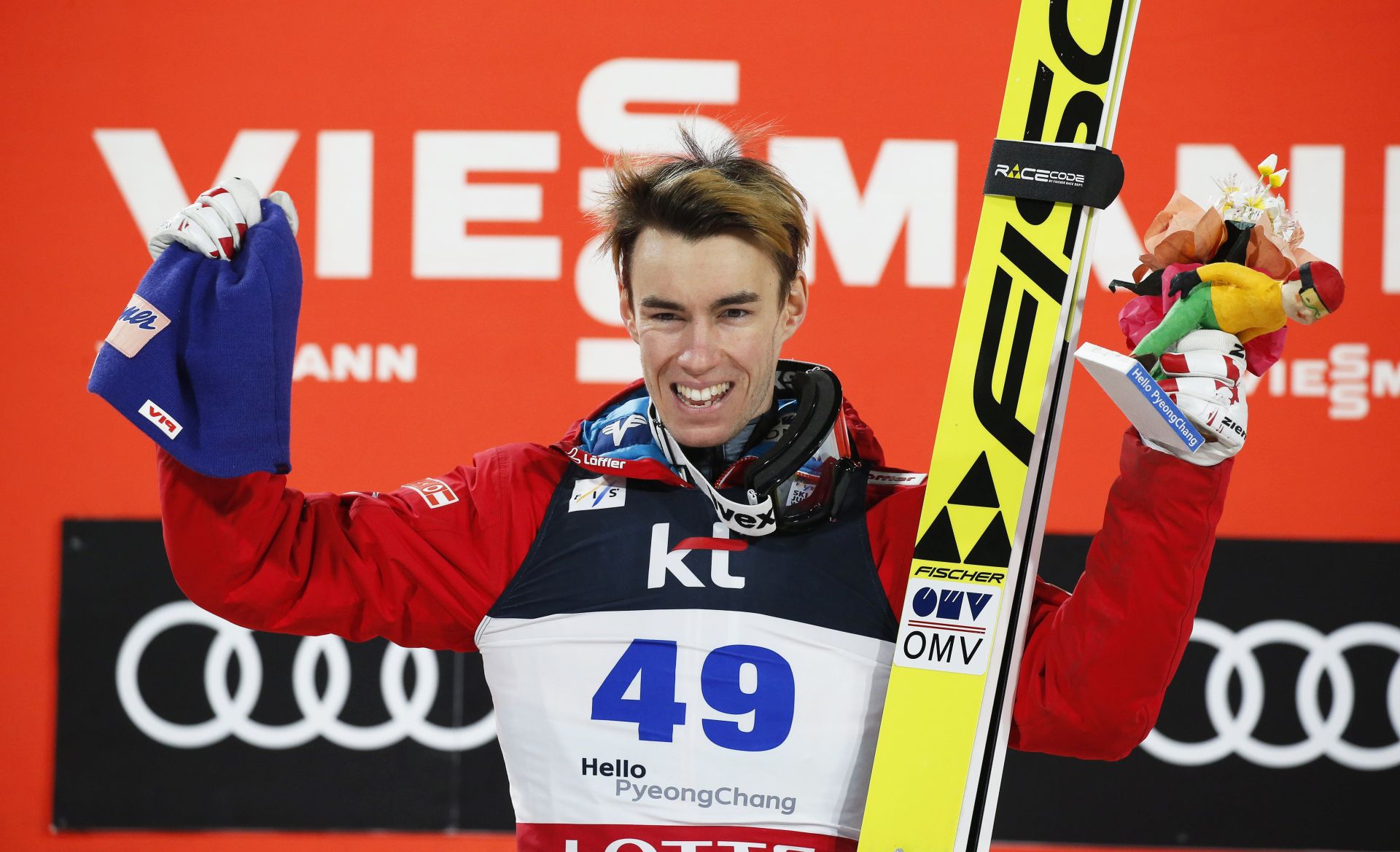 epa05794724 Stefan Kraft of Austria celebrates on the podium after winning the men's Large Hill Individual competition of the FIS Ski Jumping World Cup in Pyeongchang, South Korea, 15 February 2017.  EPA/JEON HEON-KYUN