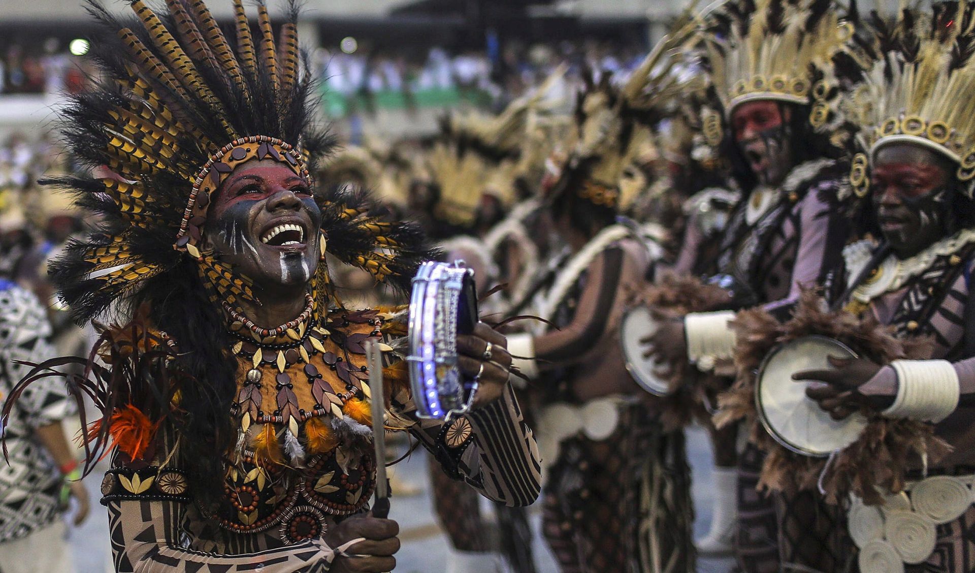 epa05818334 Members of the Special Group of the Beija-Flor samba school  perform during a parade held during Rio de Janeiro's Carnival at the Sambodromo in Rio de Janeiro, Brazil, 26 February 2017. A float accidentally ran over a group of participants injuring eight people after it lost control and crashed against one side of one of the pavillions, it was when it reversed to get back on track when it ran over eight of the participants taking part in the parade.  EPA/ANTONIO LACERDA