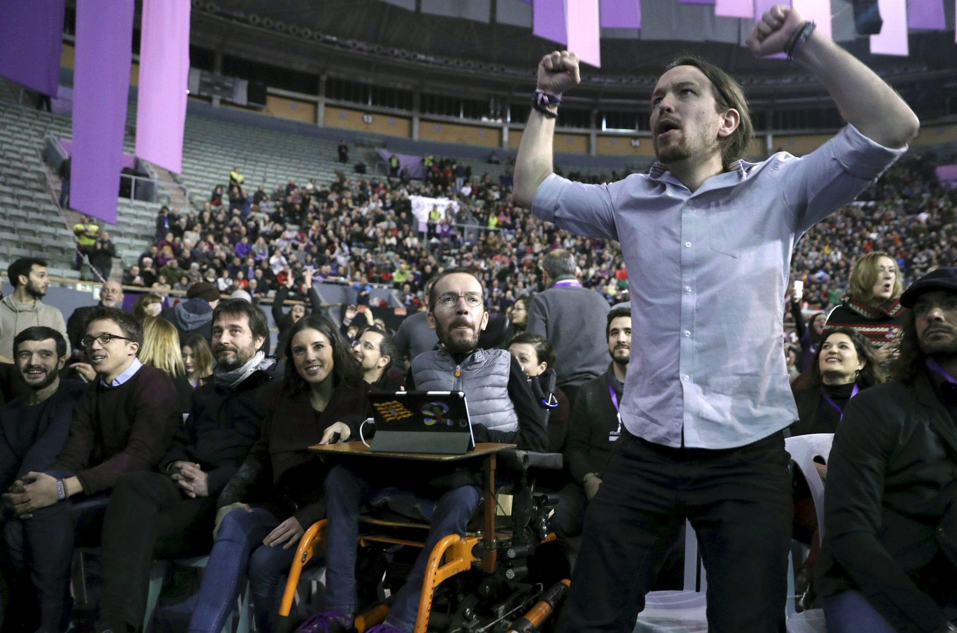 epa05784746 Spanish party 'Podemos' Secretary-General, Pablo Iglesias (R), stands next to secretary of organization, Pablo Echenique (2-R), and party members Pablo Bustinduy (L), Inigo Errejon (2-L), Rafael Mayoral (3-L), and Irene Montero (3-R), during the 2nd Podemos Citizen Assembly, Vistalegre II, in Madrid, Spain, 11 February 2017. The assembly, which will be held on 11 and 12 February, will define the future of the party.  EPA/CHEMA MOYA