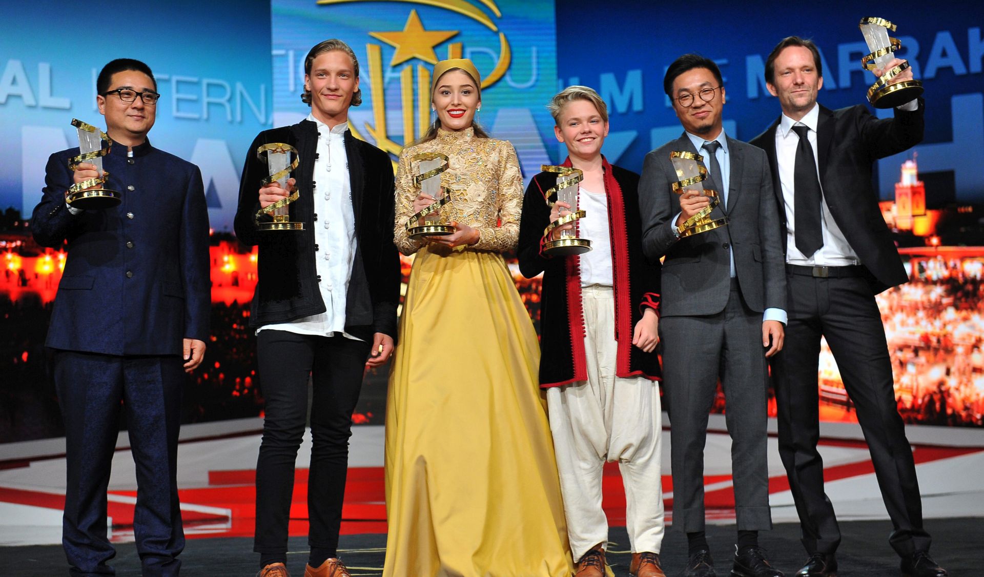 epa05670102 (L-R) Award winners Chinese director Zang Qi Wu (Grand Prize 'Star of Gold' for the film 'Donor'), Icelandic actor Blaer Hinriksson (Best Male Performance for the film 'Hearststone'), Afghan actress  Freshteh Hossein (best performance by an actress for 'Parting'), Danish actor Bladur Einarsson (Best Male Performance for the film 'Hearststone'), Chinese producer Wang Zijian (best directing prize for the film 'Knife in the clear water')  and Italian director (best jury prize for the film 'Mister Universo') during the award ceremony of the 16th Marrakesh International Film Festival in Marrakesh, Morocco, 10 December 2016.  EPA/ABDELHAK SENNA