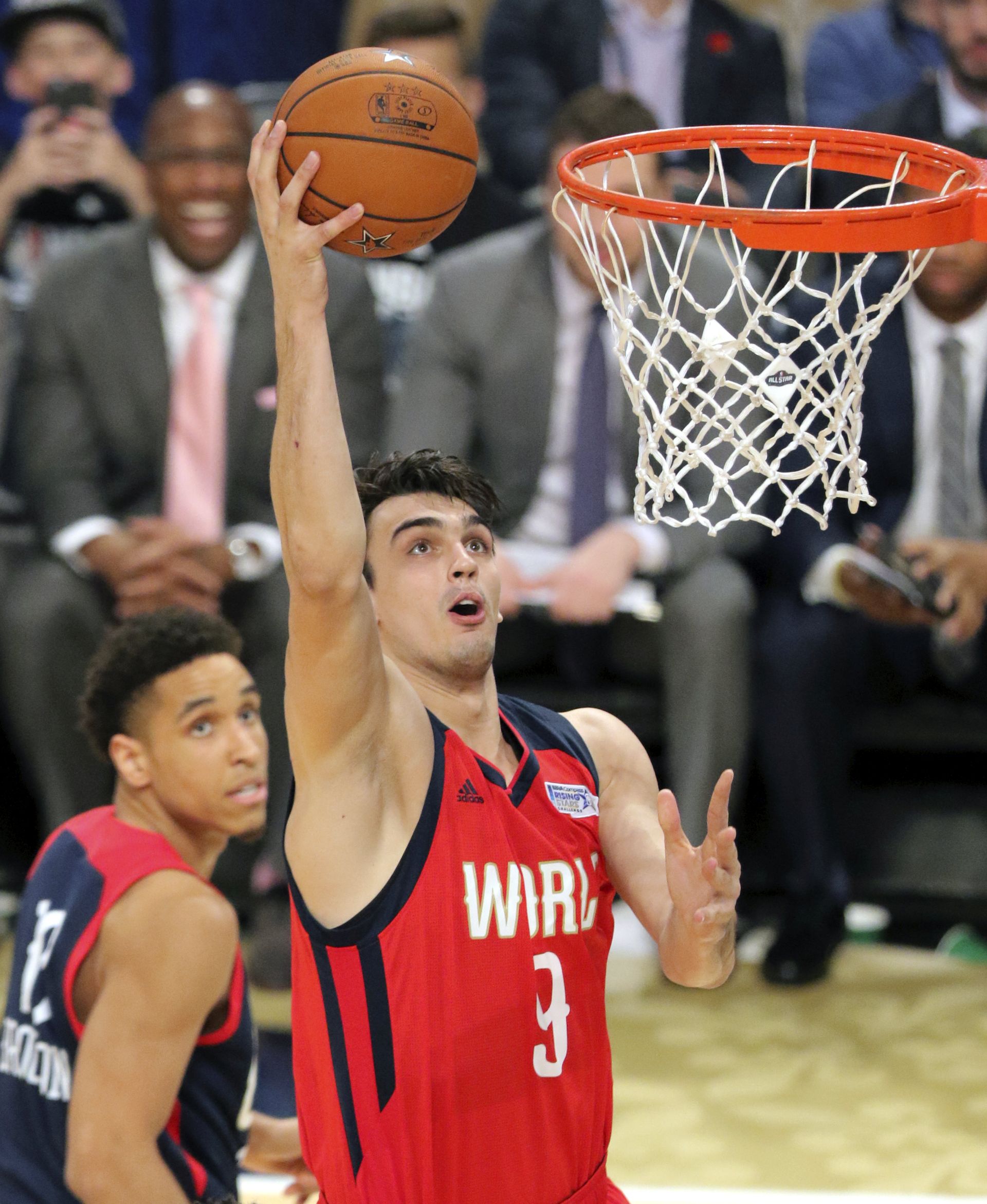 epa05800965 World Team player Dario Saric of Croatia goes to the basket against the United States team during the NBA Rising Stars Challenge at Smoothie King Center, part of the NBA All-Star weekend in New Orleans, Louisiana, 17 February 2017. The NBA All-Star Game will be played 19 February in New Orleans.  EPA/DAN ANDERSON