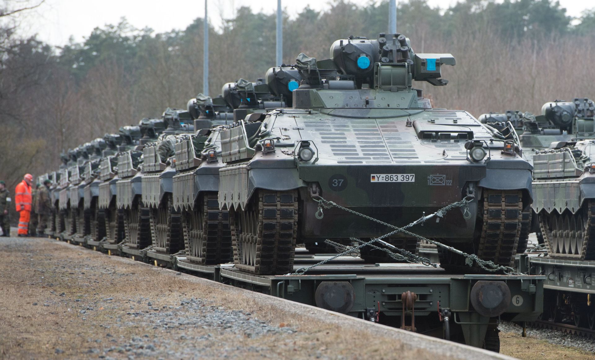 epa05806821 German army tanks of type 'Marder' are loaded onto a train for transport to Lithuania at the military training area in Grafenwoehr, Germany, 21 February 2017. Germany will deploy tanks to Lithuania as part of a NATO mission aimed to support eastern European allies.  EPA/TIMM SCHAMBERGER
