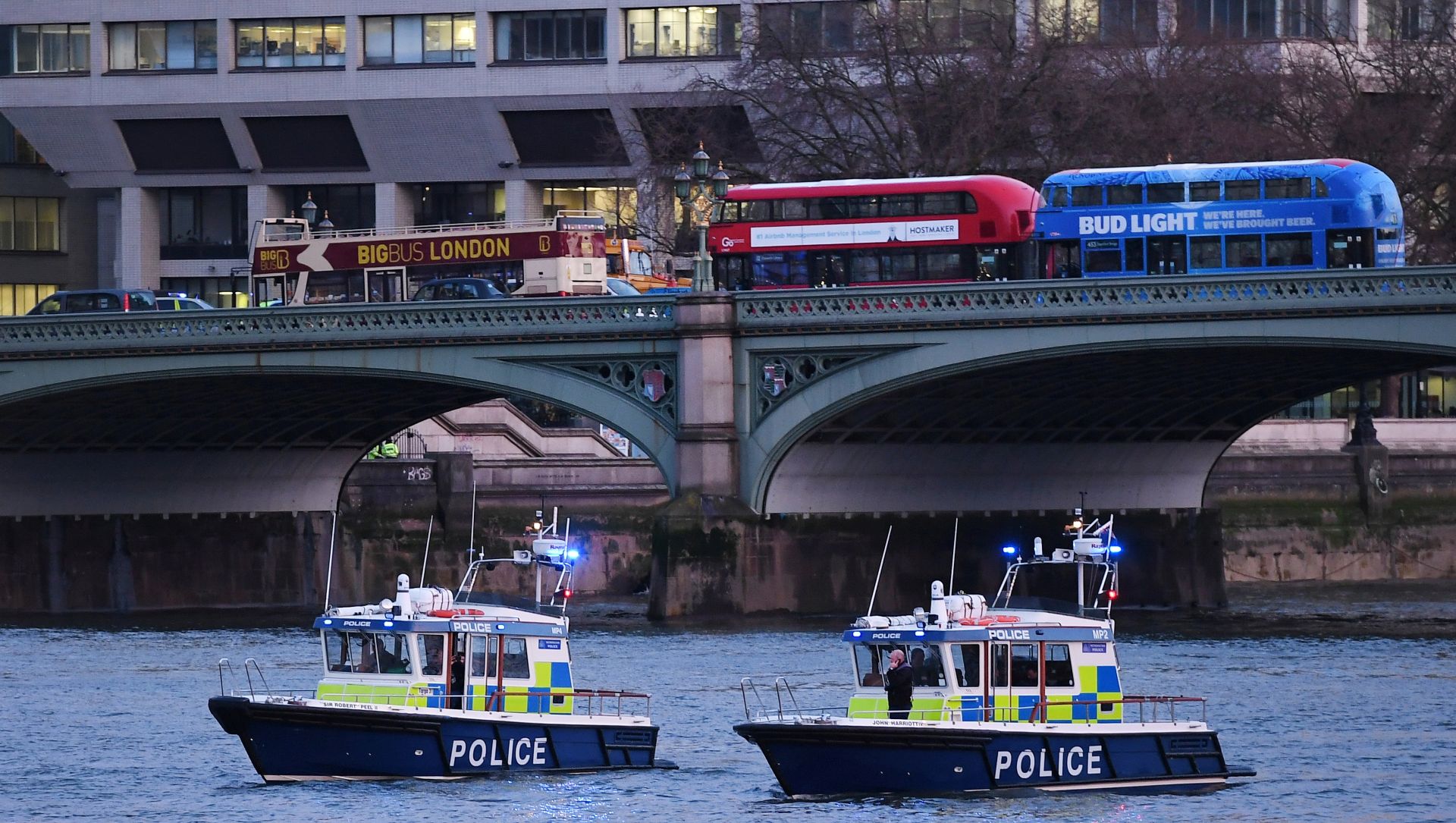 epa05864204 Met Police boats patrol along the Thames river following a terror attack in London, Britain, 22 March 2017. Scotland Yard said on 22 March 2017 the police were called to a firearms incident in the Westminister palace grounds and on Westminster Bridge amid reports of at least four people killed, including the attacker, and several other people injured in central London.  EPA/ANDY RAIN