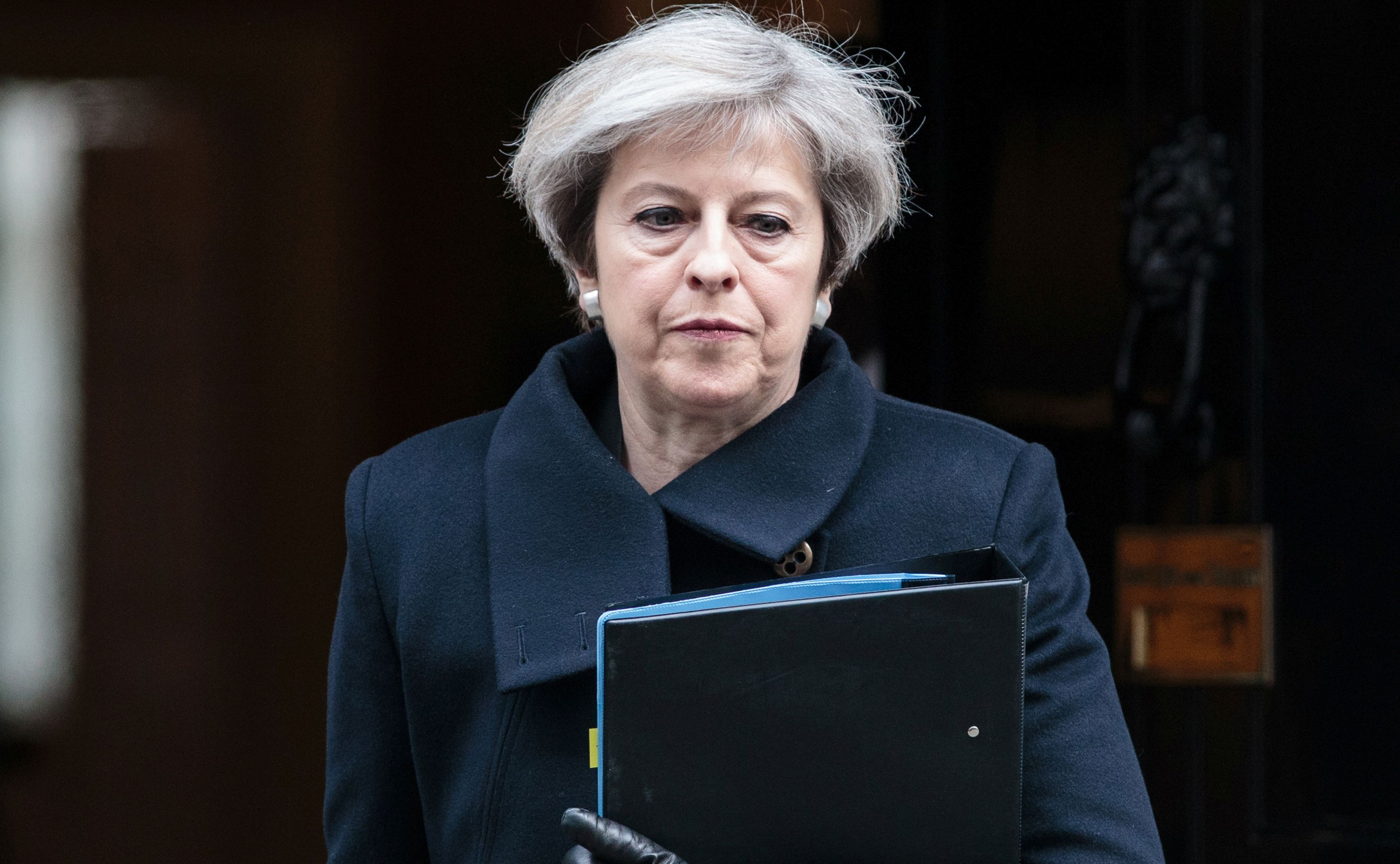 epa05865290 British Prime Minister Theresa May leaves Downing Street in central London, England, 17 March 2017. The British Prime Minister Theresa May spoke on 22 March 2017 after a terrorist attack took place in Westminster, saying Parliament would meet as normal today and 'We will come together as normal'.  PC Keith Palmer and three others lost their lives in the attack and the perpetrator was shot dead by police.  EPA/JACK TAYLOR / POOL