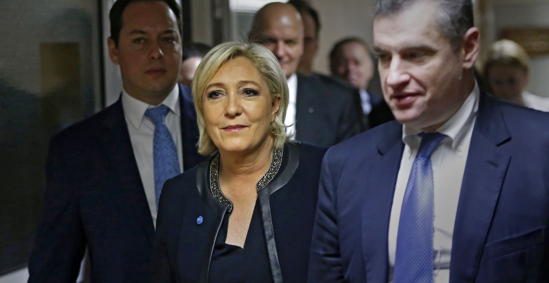 epa05867163 French presidential candidate Marine Le Pen (C) and Russian State Duma international affairs committee head Leonid Slutsky (R) walks during their meeting at the State Duma building in Moscow, Russia, 24 March 2017.  EPA/YURI KOCHETKOV