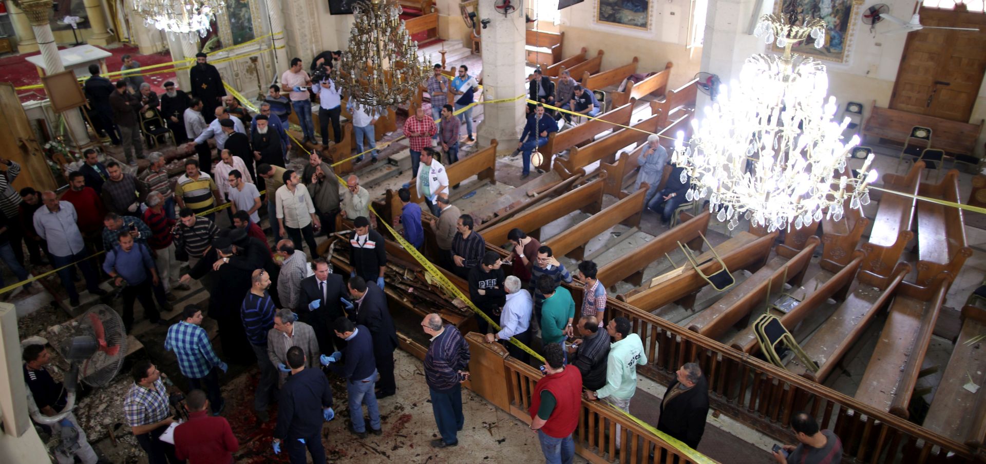 epa05898852 Security personnel investigate the scene of a bomb explosion inside Mar Girgis church in Tanta, 90km north of Cairo, Egypt, 09 April 2017. According to the Egyptian Health Ministry, at least 21 were killed and 69 injured in a bomb explosion at Mar Girgis Coptic church in the central delta city of Tanta during the Palm Sunday mass.  EPA/KHALED ELFIQI