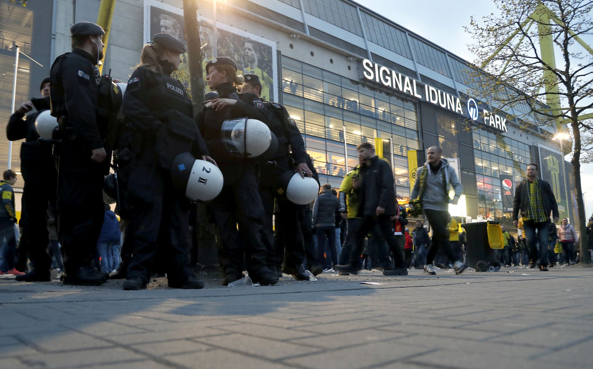 epa05903429 Police patrol arround the stadium in Dortmund, Germany, 11 April 2017. According to reports, Borussia Dortmund's team bus was damaged by three explosions on 11 April, as it was on its way to the stadium ahead of the UEFA Champions League soccer match between Borussia Dortmund and AS Monaco. Borussia Dortmund's player Marc Bartra was injured and is hospitalized. The match has been postponed.  EPA/FRIEDEMANN VOGEL