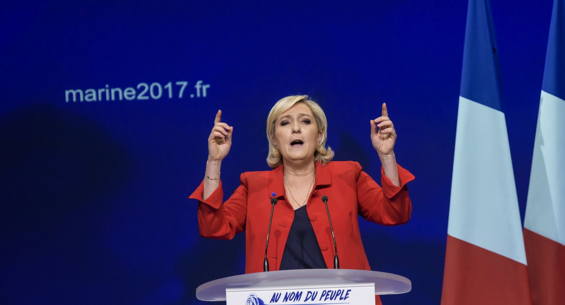 epa05912869 Marine Le Pen, French National Front (FN) political party leader and candidate for French 2017 presidential election, delivers a speech during an election campaign rally in Paris, France, 17 April 2017. France holds the first round of the 2017 presidential elections on 23 April 2017.  EPA/CHRISTOPHE PETIT TESSON