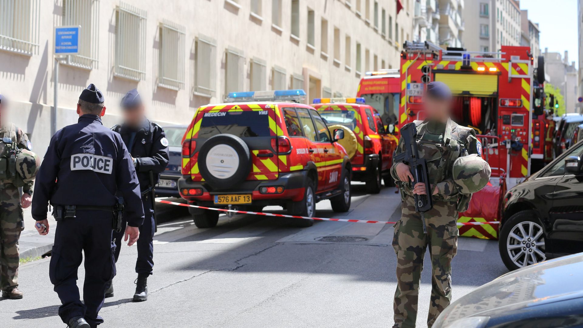 epa05913600 French soldiers, policemen and firefighter vehicles are seen at the site of a police search operation at the home of one of two men arrested, in the third district of Marseille, France, 18 April 2017. The two men are suspected of preparing an attack just days ahead of the first round of France's presidential vote. The suspects, aged 23 and 29, were taken into custody by French domestic intelligence service agents in the southern city of Marseille, a source close to the probe said.  EPA/DAVID ROSSI OFFICIALS FACES PIXELATED BY SOURCE
FRANCE OUT / NO MAG SALES