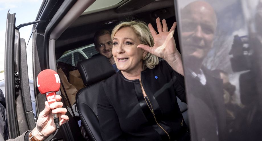 epa05928742 French presidential election candidate for the far-right Front National (FN) party, Marine Le Pen (C) waves to the crowd after meeting with supporters and Whirlpool employees outside the Whirlpool plant in Amiens, northern France, 26 April 2017. Emmanuel Macron and far-right Front National (FN) party candidate Marine Le-Pen arrived in the lead positions on the first round of the presidential elections. France will hold the second round on 07 May 2017.  EPA/CHRISTOPHE PETIT TESSON