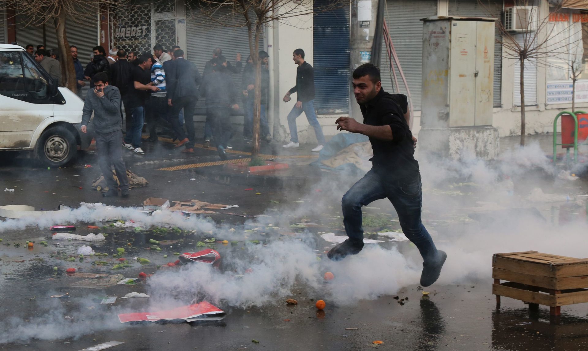 epa05191034 Kurdish protestors clash with Turkish riot police during a protest against the Turkish Government's ongoing security operations in the east of Turkey, in Diyarbakir, Turkey, 27 February 2016. The Turkish police used plastic bullets, tear gas and water cannons on demonstrators protesting a curfew in the largely Kurdish city of Diyarbakir. Thousands of protesters continued marching towards the city's Sur district, which has been under curfew since December, Feleknas Uca, a pro-Kurdish opposition party representative in Diyarbakir said.  EPA/STR