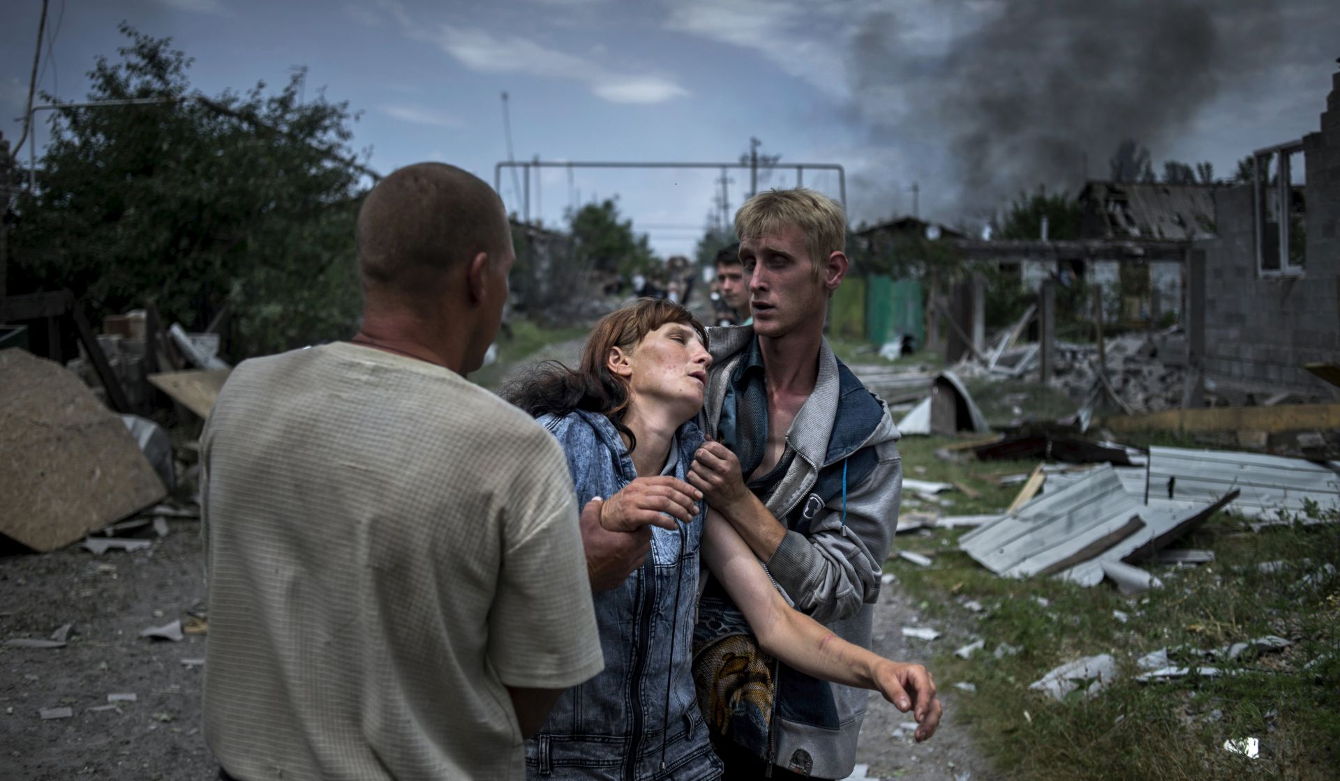 epa05790452 A handout photo made available by the World Press Photo (WPP) organization on 13 February 2017 shows a picture by Rossiya Segodnya photographer Valery Melnikov that won the Long-Term Projects - First Prize award of the 60th annual World Press Photo Contest, it was announced by the WPP Foundation in Amsterdam, The Netherlands on 13 February 2017.

Long-Term Projects - First Prize

© Valery Melnikov, Rossiya Segodnya
Title: Black Days Of Ukraine

Photo caption: 
Citizens in the village of Luhanskaya after the air attack.

Story: 
Ordinary people became victims of the conflict between self-proclaimed republics and the official Ukrainian authorities from 2014 onwards in the region of Donbass. Disaster came into their lives unexpectedly. These people were involved in the military confrontation against their will. They experienced the most terrible things: the death of their friends and relatives, destroyed homes and the ruined lives of thousands of people.  EPA/Valery Melnikov/Rossiya Segodnya/WORLD PRESS PHOTO HANDOUT ATTENTION EDITORS : EDITORIAL USE ONLY / NO SALES / NO ARCHIVE / NO CROPPING / NO MANIPULATING / USE ONLY FOR SINGLE PUBLICATION IN CONNECTION WITH THE WORLD PRESS PHOTO AND ITS ACTIVITIES HANDOUT EDITORIAL USE ONLY/NO SALES/NO ARCHIVES HANDOUT EDITORIAL USE ONLY/NO SALES/NO ARCHIVES