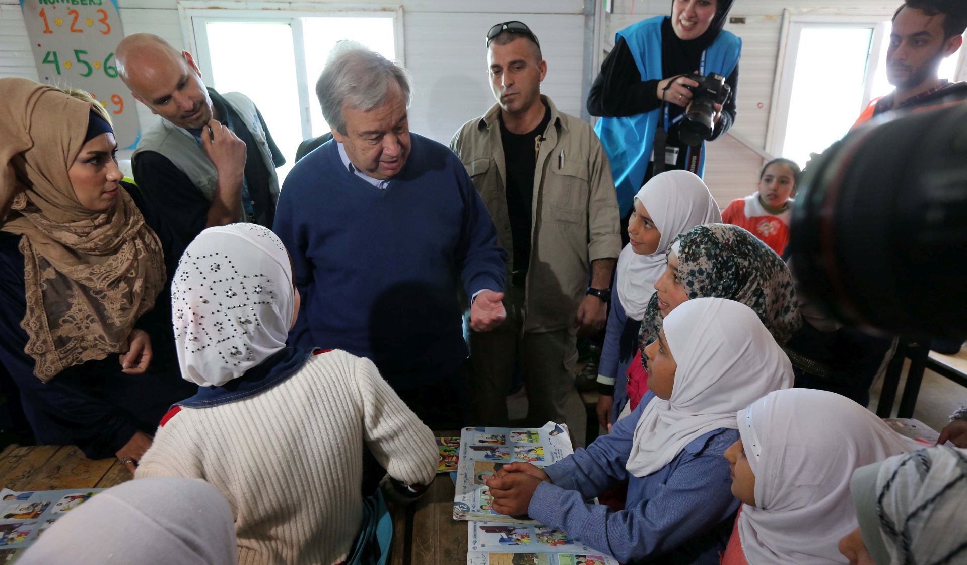 epa05875596 A handout photo made available by the United Nations shows UN Secretary-General Antonio Guterres speaking with school children during a visit to Zaatari refugee camp in Jordan, 28 March 2017. During a visit to Zaatari refugee camp in Jordan, Gutterres urged on 28 March all parties to the Syrian conflict to exert new peace efforts in the talks in Geneva.  EPA/UN PHOTO / SAHEM RABABAH HANDOUT  HANDOUT EDITORIAL USE ONLY/NO SALES
