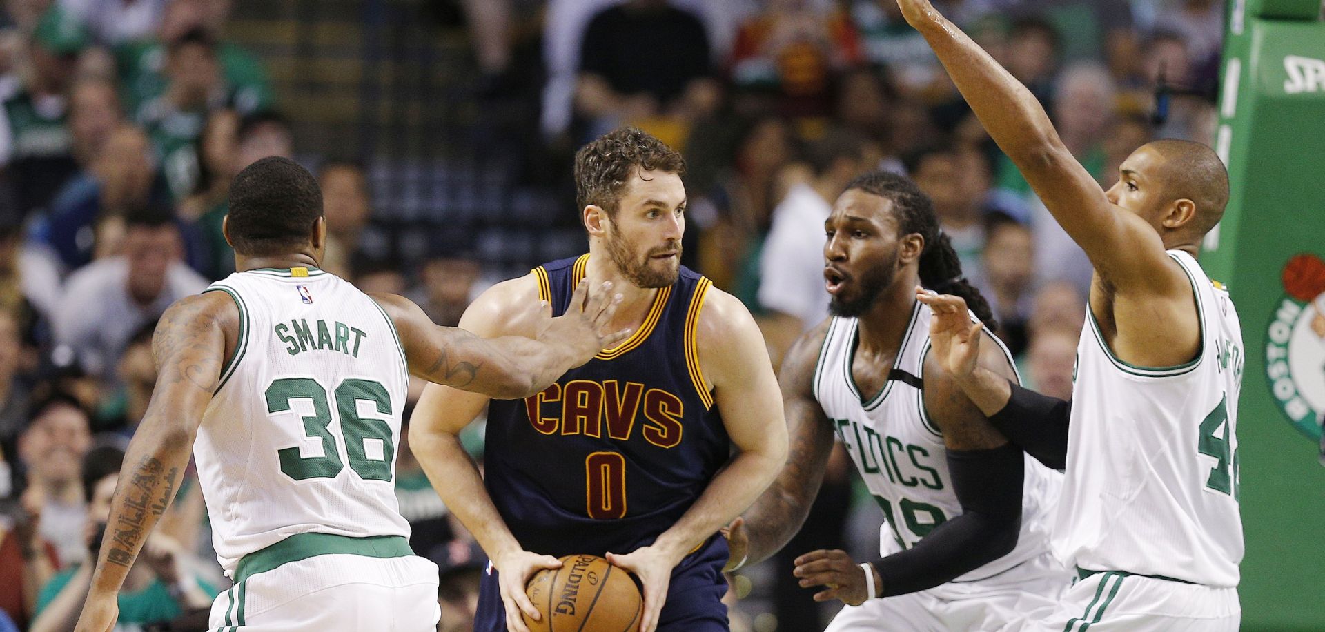 epa05975545 Cleveland Cavaliers forward Kevin Love (2L) is guarded by Boston Celtics (L-R) Marcus Smart, Jae Crowder and Al Horford during the second half of their NBA Eastern Conference Final game two at the TD Garden in Boston, Massachusetts, USA, 19 May 2017. The winner of the best-of-seven series will go on to face either the San Antonio Spurs or the Golden State Warriors in the NBA Finals.  EPA/CJ GUNTHER