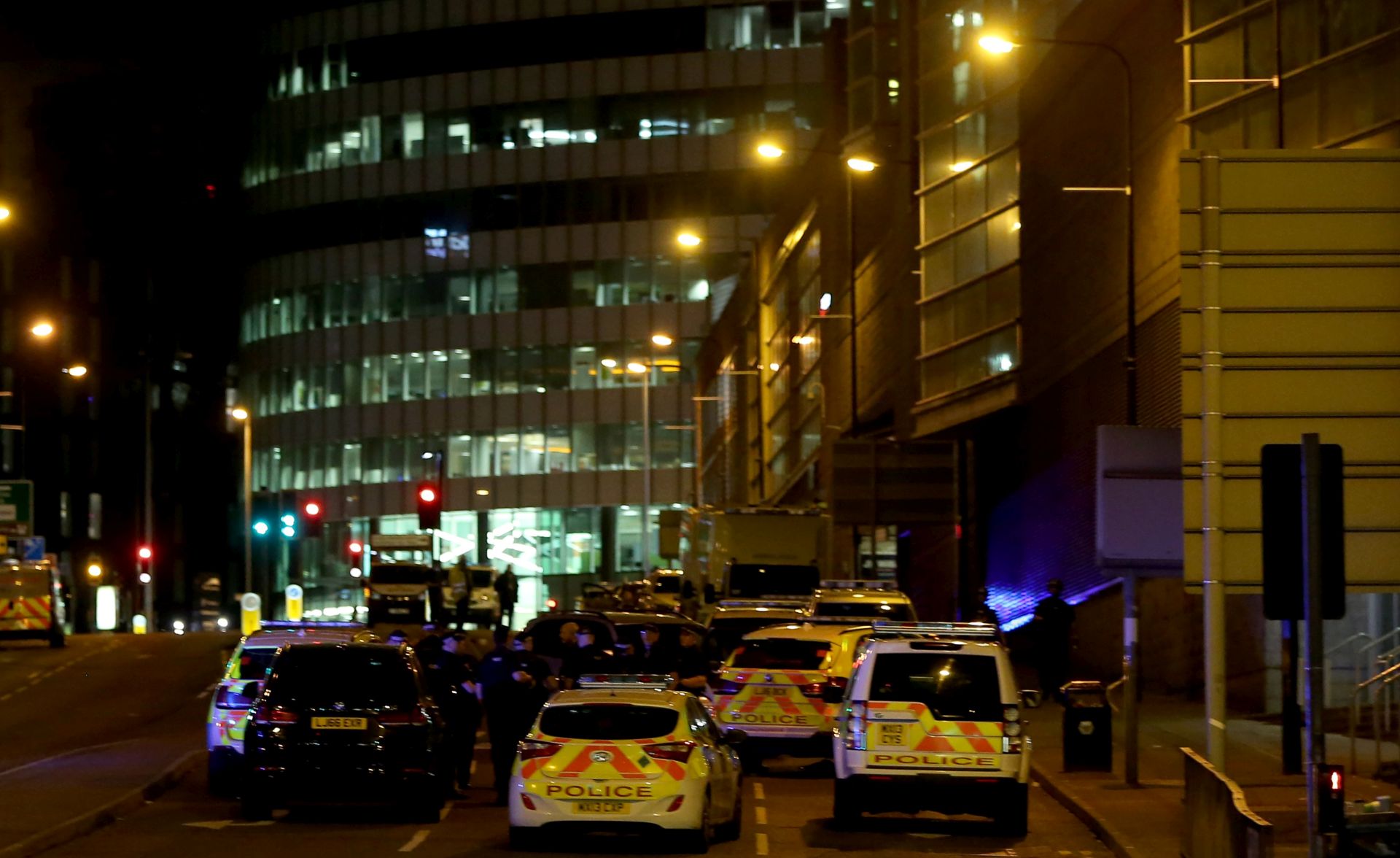 epa05982573 Emergency vehicles are seen outside the Manchester Arena following reports of an explosion, in Manchester, Britain, 23 May 2017. According to a statement released by the Greater Manchester Police on 23 May 2017, police responded to reports of an explosion at Manchester Arena on 22 May 2017 evening. At least 19 people have been confirmed dead and others 50 were injured, authorities said. The happening is currently treated as a terrorist incident until police know otherwise. According to reports quoting witnesses, a mass evacuation was prompted after explosions were heard at the end of US singer Ariana Grande's concert in the arena.  EPA/NIGEL RODDIS