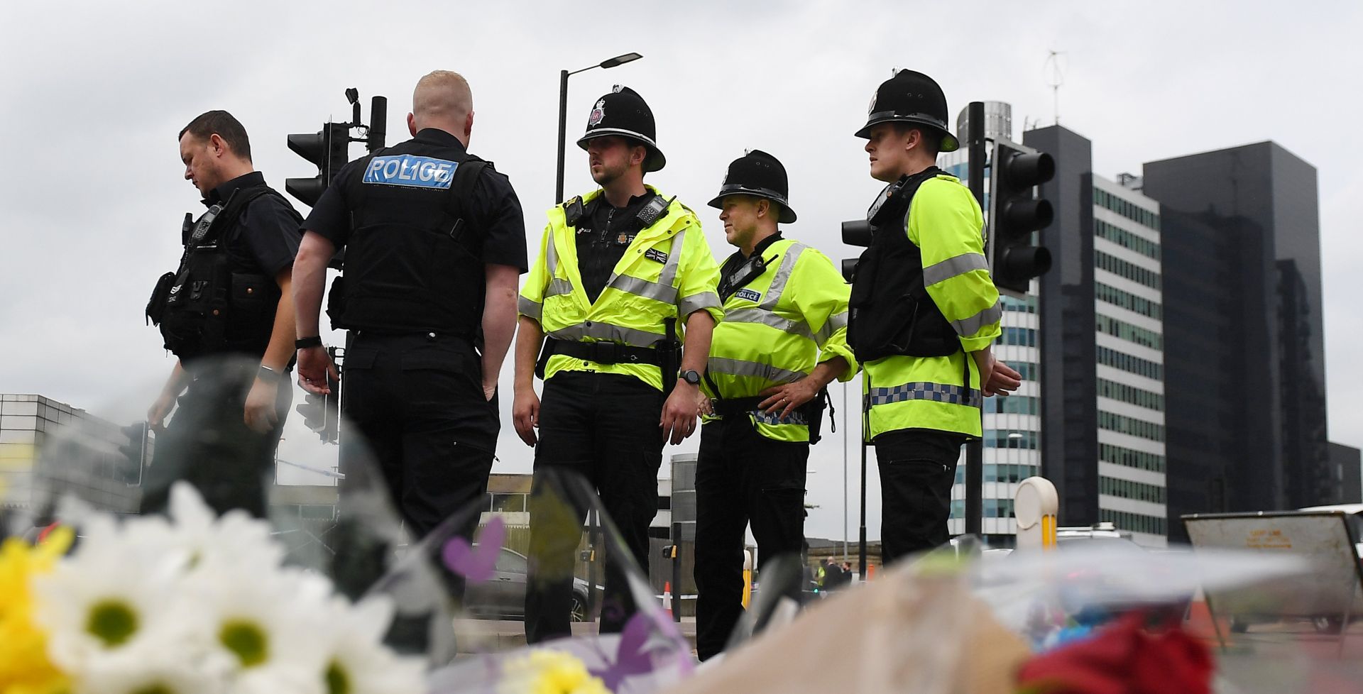 epa05986277 Police gathers at the scene of the Manchester terror attack outside the Manchester Arena in central Manchester, Britain, 24 May 2017. Britain is on critical alert following the Manchester terror attack on the Manchester Arena late 22 May, that saw 22 people loose their lives with scores of people injured. The government has indicated that the military are to be deployed on the streets along side the police.  EPA/ANDY RAIN