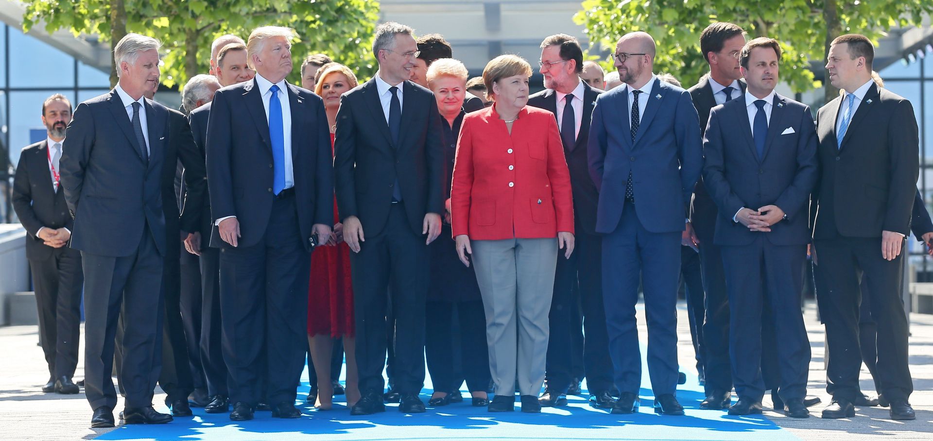epa05989719 (front L-R) Belgian King Philippe, US President Donald J. Trump, NATO Secretary General Jens Stoltenberg, German Chancellor Angela Merkel, Belgian Prime Minister Charles Michel, Luxembourg's Prime Minister Xavier Bettel, and Estonian Prime Minister Juri Ratas walk with fellow dignitaries during the unveiling of a monument at the new NATO Headquarters during the NATO summit in Brussels, Belgium, 25 May 2017. NATO countries' heads of states and governments gather in Brussels for a one-day meeting.  EPA/STEPHANIE LECOCQ