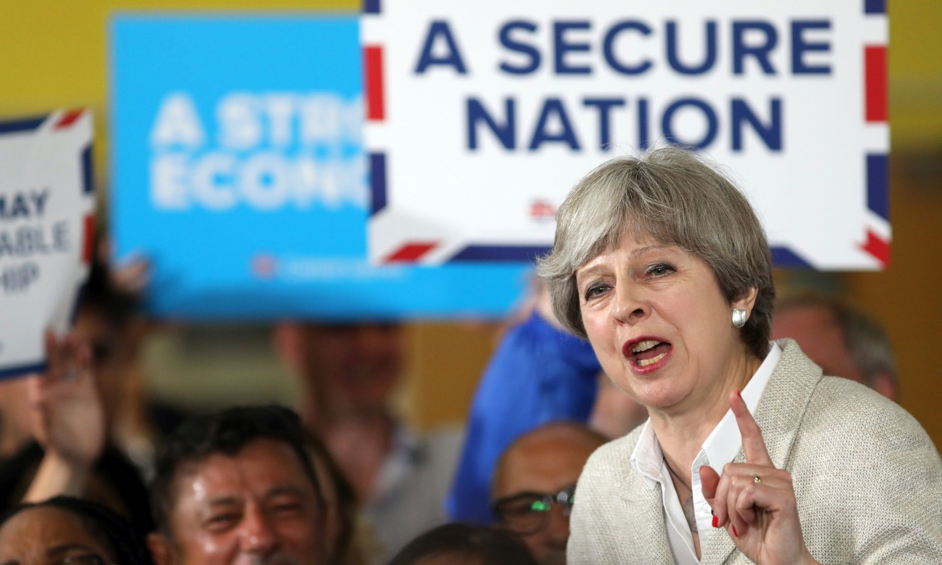 epa05997625 British Prime Minister Theresa May, the leader of the Conservative Party, gestures as she speaks during a campaign event in Twickenham, London, Britain, 29 May 2017. Mays Conservatives maintained their focus on terrorism after the attack on a pop concert on 22 May. The oppositional Labour said the Prime Minister's U-turn on care for the elderly on the same day left many questions unanswered.  EPA/CHRIS J. RATCLIFFE / POOL