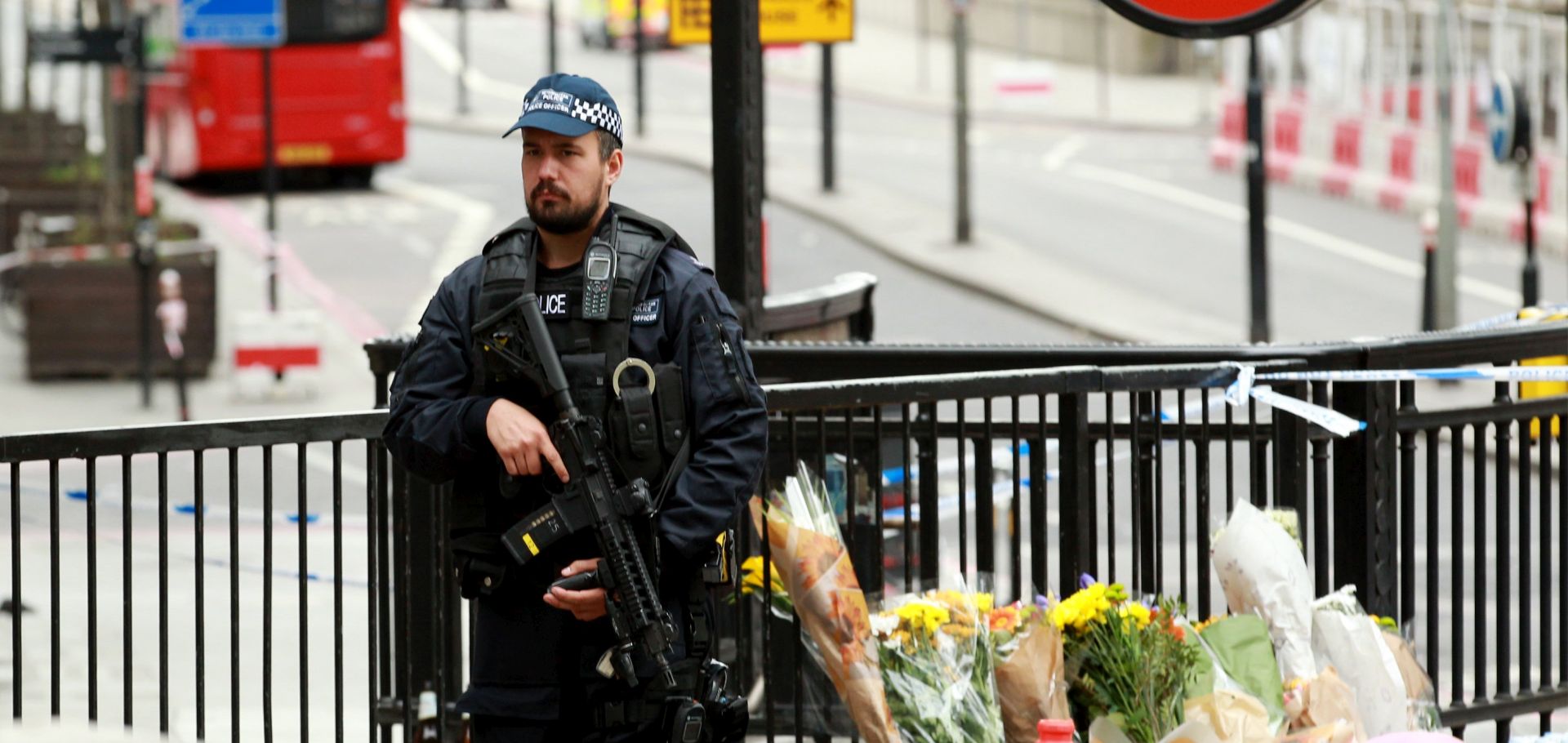 epa06010230 A British police officer on patrol around London Bridge near the site of an attack, London, Britain, 04 June 2017. At least seven members of the public were killed and dozens injured after three attackers on late 03 June plowed a van into pedestrians and later randomly stabbed people on London Bridge and nearby Borough Market. The three attackers wearing fake suicide vests were shot dead by police who are treating the attack as a 'terrorist incident.'  EPA/SEAN DEMPSEY