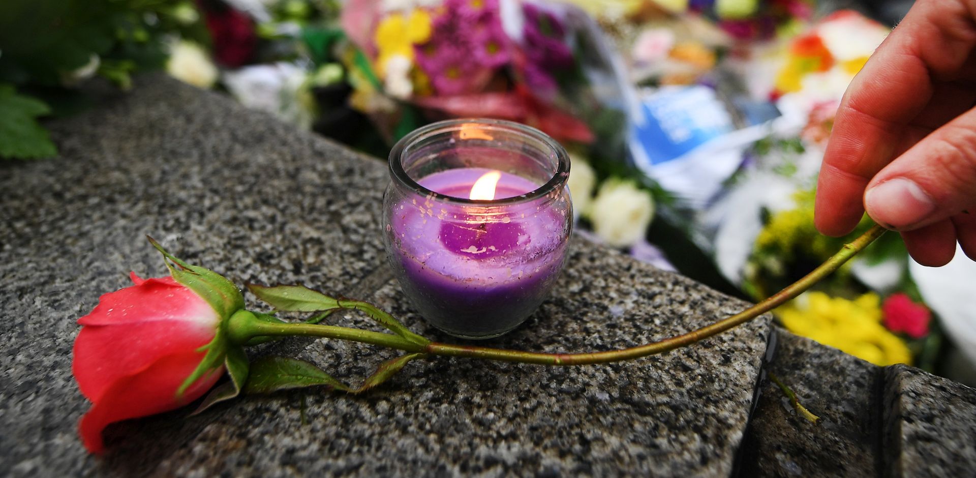 epa06012425 Floral tributes during a vigil outside City Hall in London, Britain, 05 June 2017. At least seven members of the public were killed and dozens injured after three attackers on late 03 June plowed a van into pedestrians and later randomly stabbed people on London Bridge and nearby Borough Market. The three attackers wearing fake suicide vests were shot dead by police who are treating the attack as a 'terrorist incident.'  EPA/ANDY RAIN