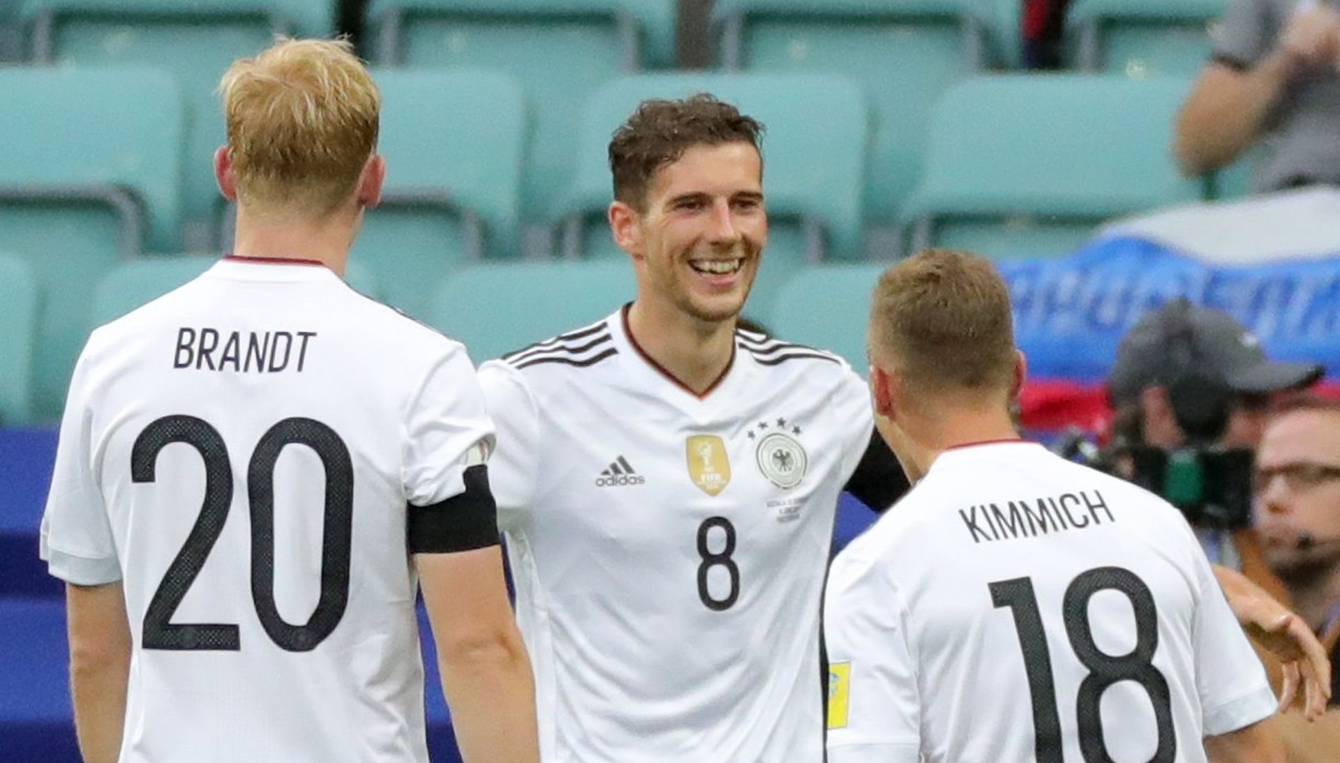 epa06037648 Leon Goretzka (C) of Germany celebrates with teammates after scoring the 3-1 lead  during the FIFA Confederations Cup 2017 group B soccer match between Australia and Germany at the Fisht Stadium in Sochi, Russia, 19 June 2017.  EPA/ARMANDO BABANI