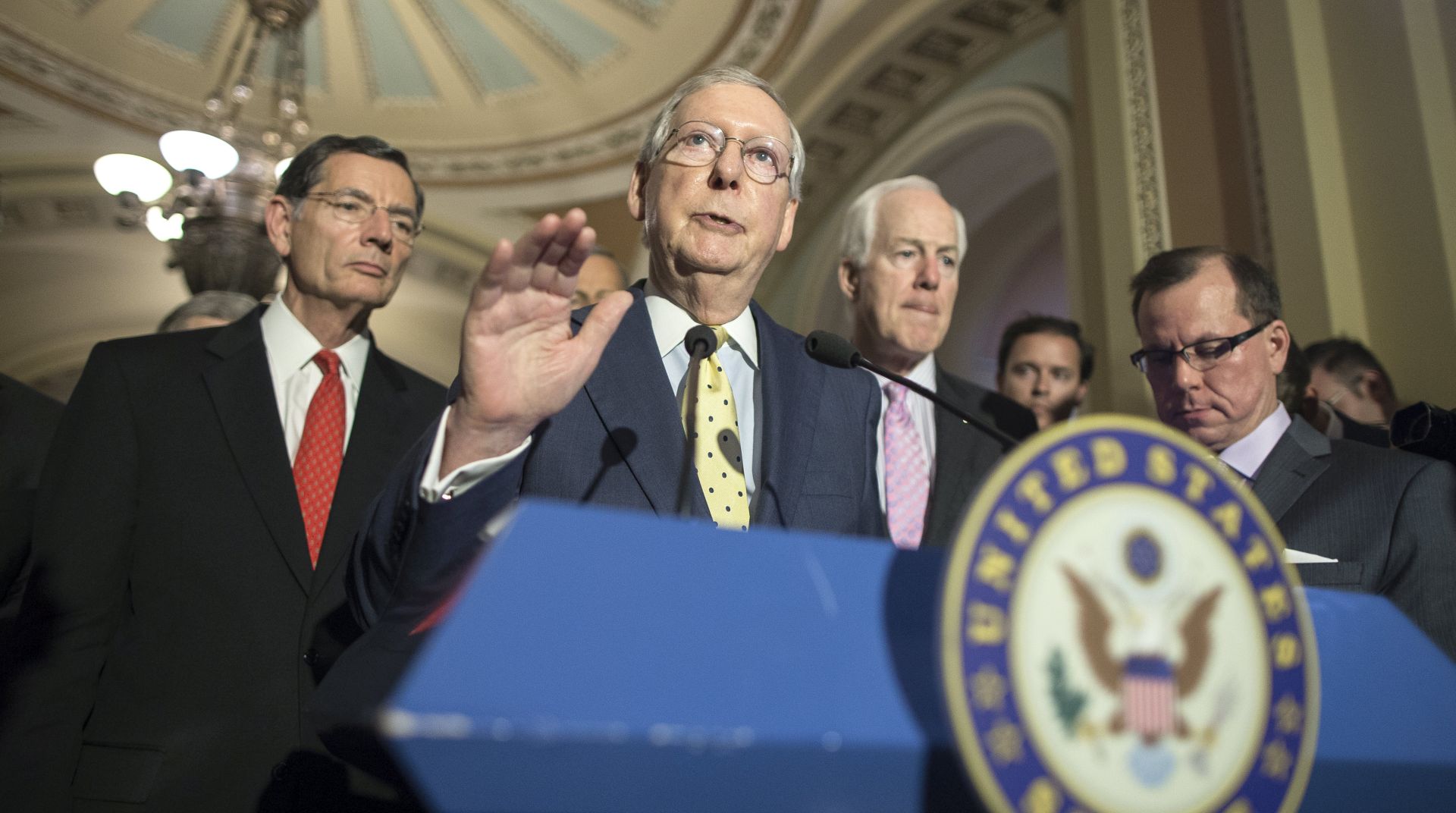 epa06039823 Senate Majority Leader Republican Mitch McConnell (C), speaks on a Republican-crafted healthcare bill during a news conference beside Republican Senator from Wyoming John Barrasso (L) and Republican Senator from Texas John Cornyn (R), on Capitol Hill in Washington, DC, USA, 20 June 2017. A Republican-crafted healthcare bill that would replace the Affordable Care Act is being put together by a group of 13 Republican Senators and Democrats have yet to see the plan.  EPA/MICHAEL REYNOLDS