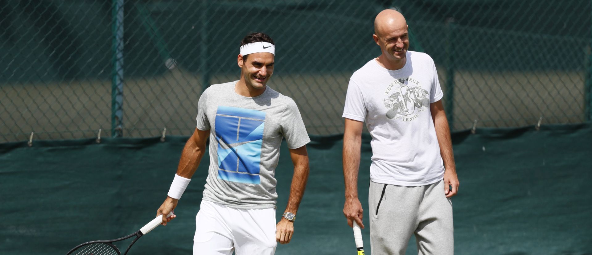 epa06059781 Roger Federer of Switzerland (L) with his coach Ivan Ljubicic during a training session prior to the Wimbledon Championships at the All England Lawn Tennis Club, in London, Britain, 01 July 2017  EPA/NIC BOTHMA EDITORIAL USE ONLY/NO COMMERCIAL SALES