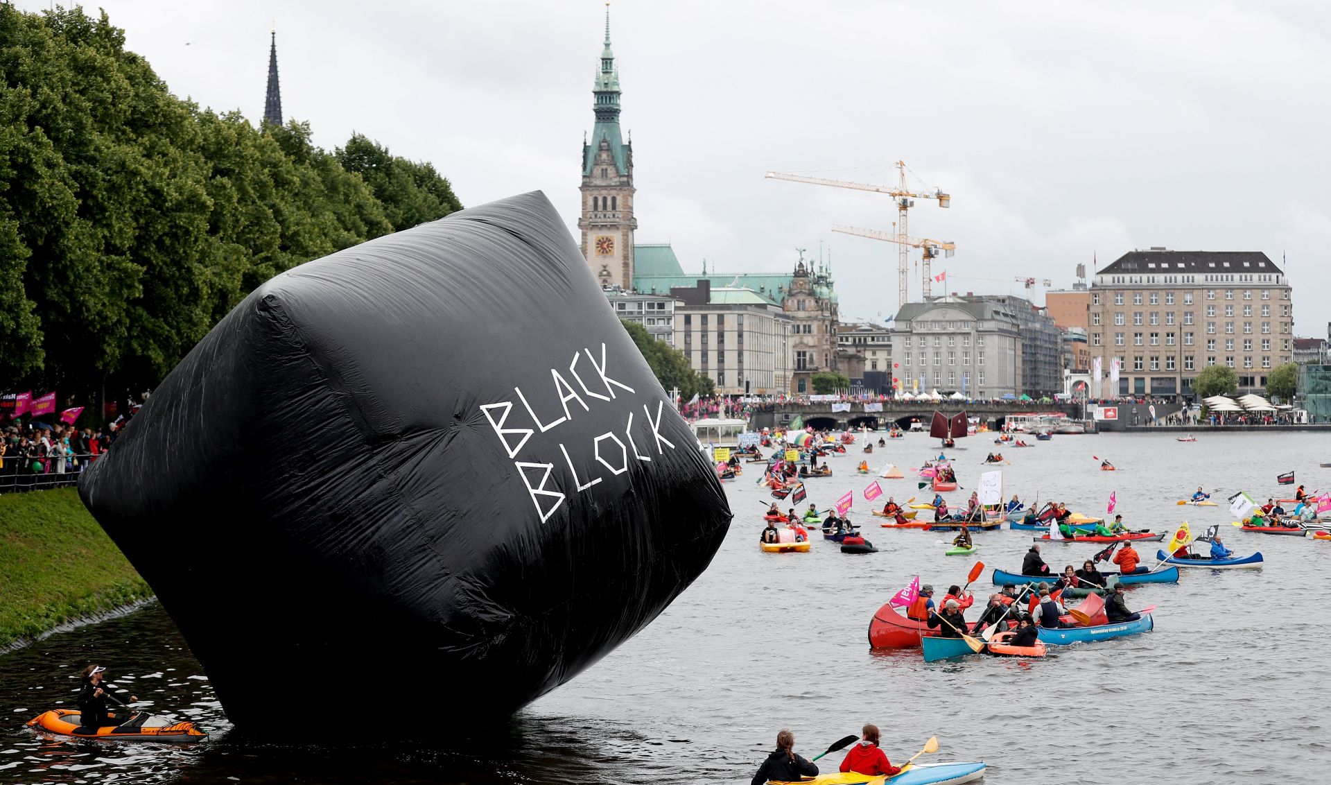 epa06061453 People in kayaks and small boats take part in a protest against the G20 summit in Hamburg, northern Germany, 02 July 2017. The G20 Summit (or G-20 or Group of Twenty) is an international forum for governments from 20 major economies. The summit is taking place in Hamburg 07 to 08 July 2017.  EPA/FRIEDEMANN VOGEL
