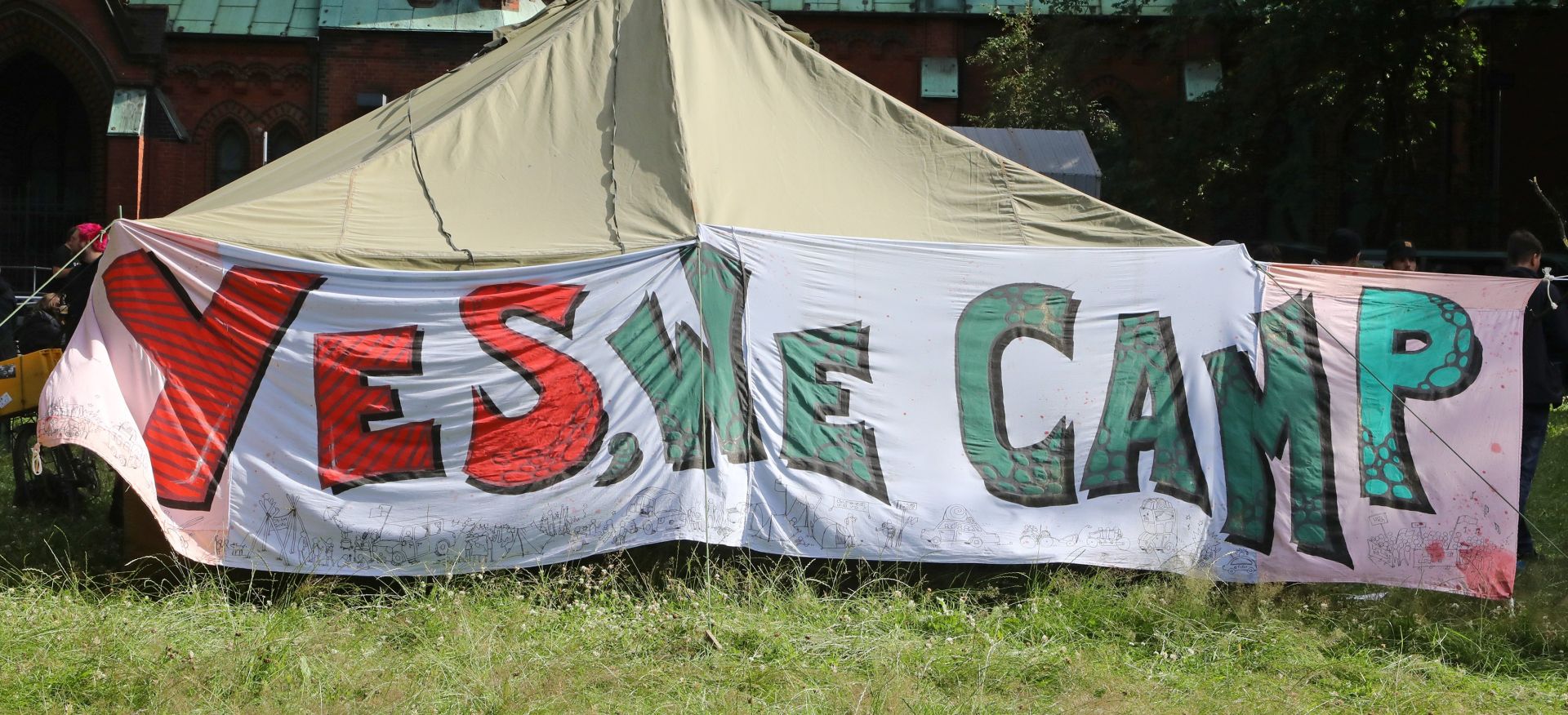 epa06065844 A banner with the inscription 'Yes, we camp' on a tent in a camp of protesters on the site of the Kulturkirche Altona church in Hamburg, northern Germany, 04 July 2017. The G20 Summit (or G-20 or Group of Twenty) is an international forum for governments from 20 major economies. The summit is taking place in Hamburg 07 to 08 July 2017.  EPA/STR