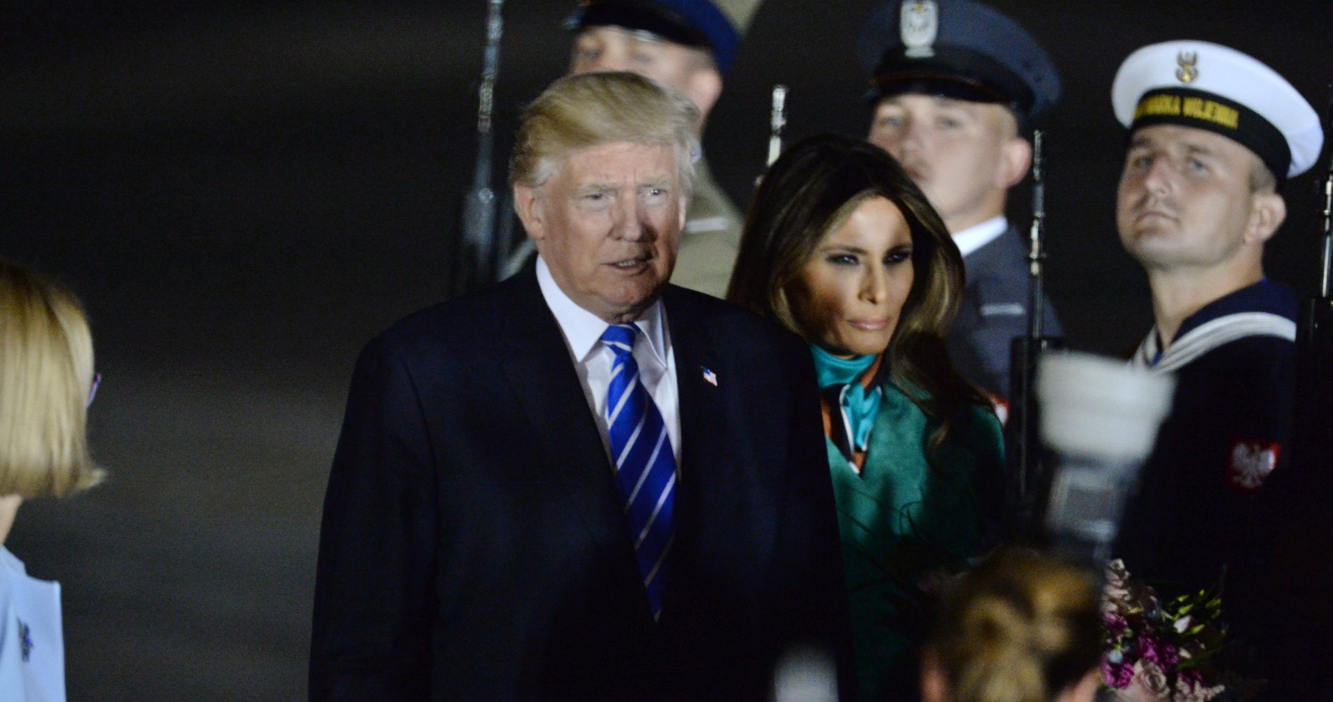 epa06068751 US President Donald J. Trump (C), First Lady Melania Trump (C-R) arrive at Okecie Airport in Warsaw, Poland, 05 July 2017.  US President Donald J. Trump is on a two-day visit in Poland. He will meet Polish President Andrzej Duda as well as speak to the leaders of Three Seas Initiative nations and address the Polish people at Warsaw's Krasinski Square.  EPA/JACEK TURCZYK POLAND OUT
