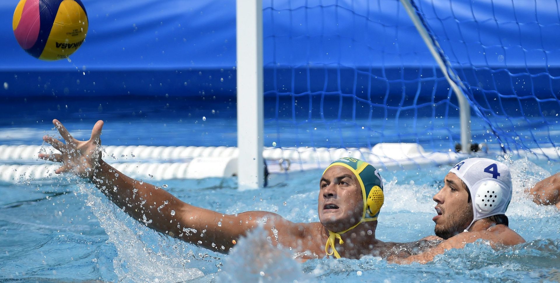 epa06105164 Joe Kayes of Australia (L) in action against Gustavo Coutinho of Brazil during the men's water polo Australia vs Brazil match for qualifying in the group of eight best teams of the 17th FINA Swimming World Championships in Hajos Alfred National Swimming Pool in Budapest, Hungary, 23 July 2017.  EPA/BALAZS CZAGANY HUNGARY OUT