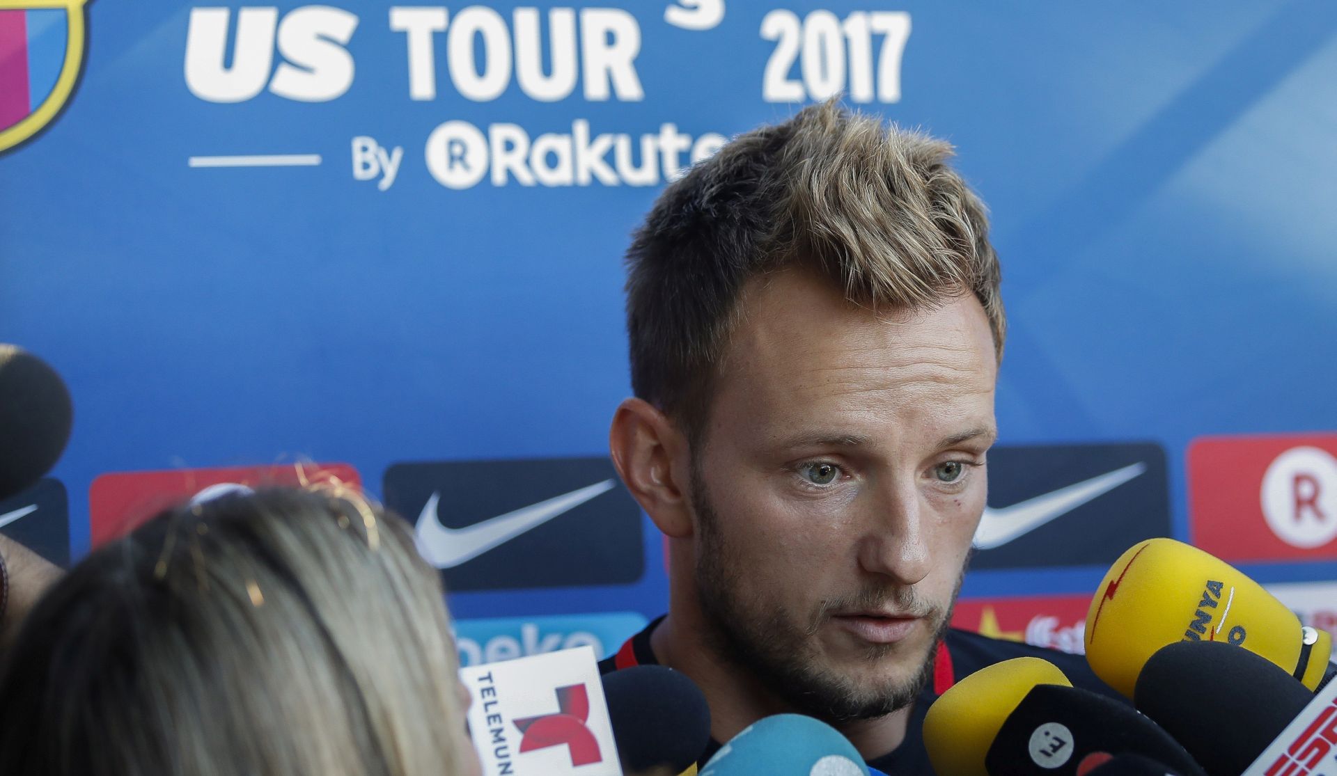 epa06113760 FC Barcelona's Croatian midfielder Ivan Rakitic talks with journalists before a team training session at Barry University in Miami, Florida, USA, 27 July 2017. FC Barcelona will play against Real Madrid in El Clasico Miami on 29 July.  EPA/JUANJO MARTIN