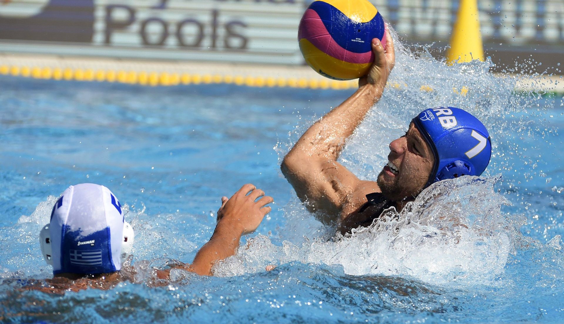 epa06116202 Ioannis Fountoulis (L) of Greece in action against Nemanja Ubovic (R) of Serbia during the men's Water Polo bronze medal match between Greece and Serbia at the 17th FINA Swimming World Championships in the Hajos Alfred National Swimming Pool in Budapest, Hungary, 29 July 2017.  EPA/BALAZS CZAGANY HUNGARY OUT