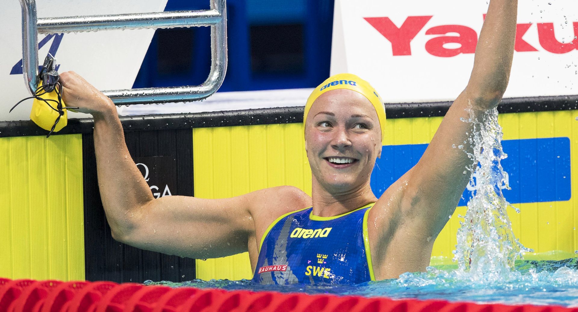 epa06116467 Sarah Sjostrom of Sweden celebrates after setting a New World Record time in the women's 50m Freestyle semi final during the 17th FINA Swimming World Championships in the Duna Arena in Budapest, Hungary, 29 July 2017.  EPA/PATRICK B. KRAEMER