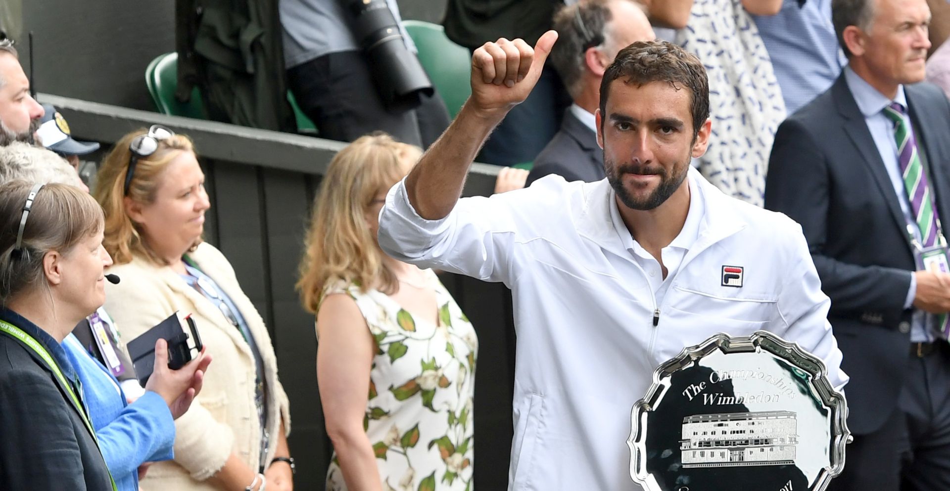 epa06091286 Marin Cilic of Croatia poses with the runner up trophy after losing against Roger Federer of Switzerland during the Men's final match for the Wimbledon Championships at the All England Lawn Tennis Club, in London, Britain, 16 July 2017.  EPA/FACUNDO ARRIZABALAGA EDITORIAL USE ONLY/NO COMMERCIAL SALES