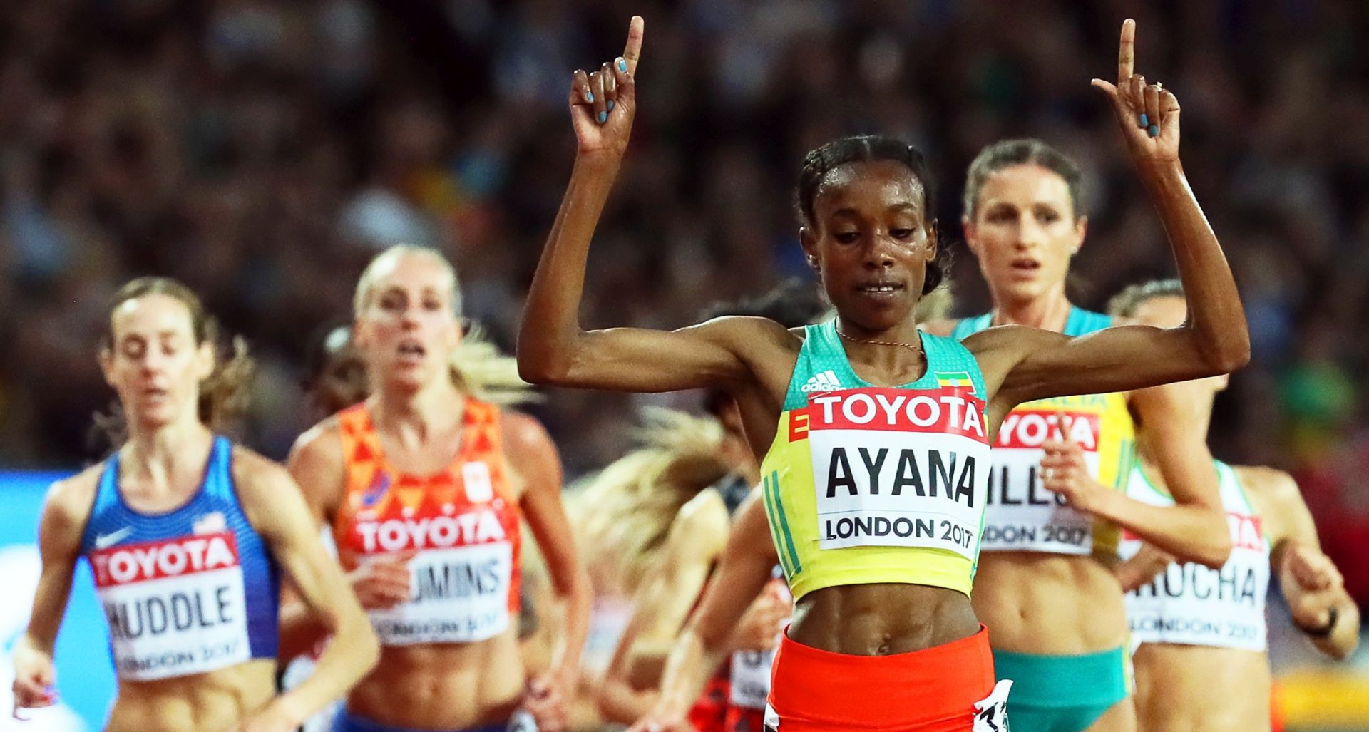epa06127089 Ethiopia's Almaz Ayana (front) reacts while crossing the finish line to win the women's 10,000m final at the London 2017 IAAF World Championships in London, Britain, 05 August 2017.  EPA/SRDJAN SUKI